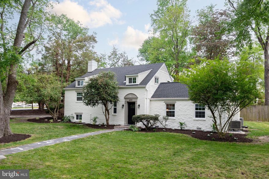 This beautifully updated home in the sought-after Wilton Woods neighborhood effortlessly blends modern amenities with timeless charm. Upon entry, you're welcomed by an inviting foyer complete with coat closet and custom built ins. The home features five bedrooms, three full bathrooms, and a convenient half bath for guests with almost 3100 square feet of living space, much larger than it appears.  The expansive main-level primary suite boasts walls of windows, a dressing area with dual closets, and a fully updated en-suite bathroom. An additional main-level in-law or au pair suite offers privacy with a separate entrance through the mudroom area, a large bedroom, and its own full bathroom with shower. The light-filled living room centers around a cozy wood-burning fireplace and is enhanced by custom lighting throughout the home. The beautifully remodeled kitchen showcases custom cabinetry, quartz countertops, stainless steel appliances, wine/beverage fridge and a long breakfast bar that opens to a separate dining room with French doors leading to the backyard. A short flight of stairs leads to a third bedroom, while the upper level offers an additional two generously sized bedrooms—one with double closets and another with a built-in dresser—along with an updated full bath and a finished, conditioned storage space. Finished lower level laundry area with new washer/dryer and countertop, custom tile and storage space. Extensive quality updates throughout this home make it move in ready.  

Situated on a desirable, 1/3-acre corner lot on a private street, the home includes excellent off-street parking and a backyard perfect for entertaining, complete with a patio area. Conveniently located just minutes from Washington, D.C., and Old Town Alexandria, the home also offers easy access to multiple metro stations, Reagan National Airport, and I-495—making it a commuter’s dream.