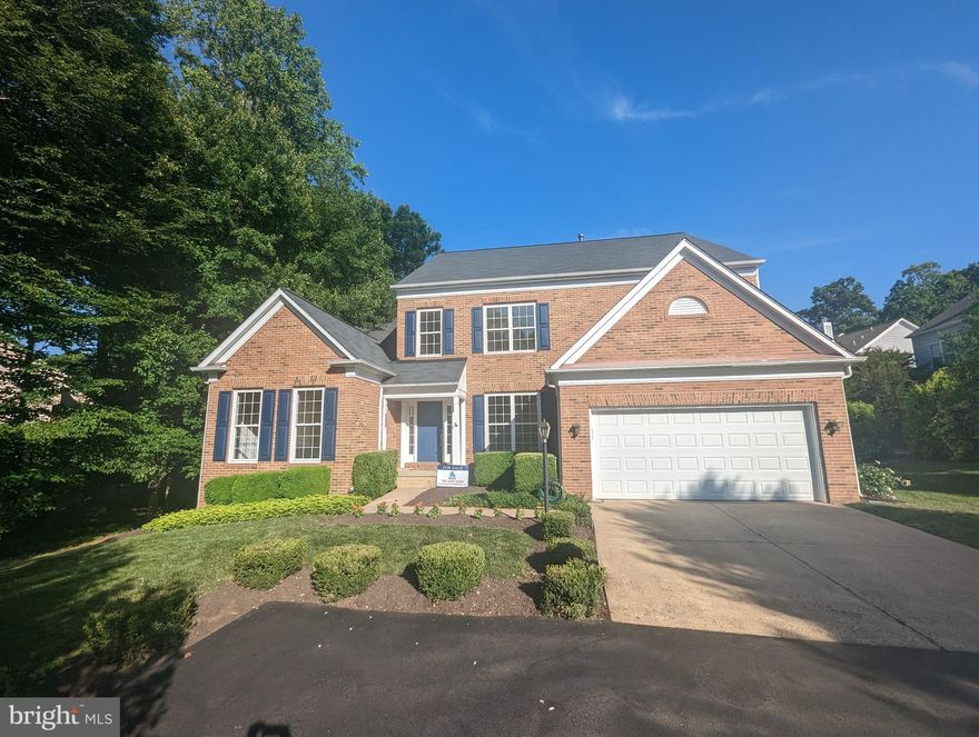 Stunning brick-front colonial home with newly refurbished hardwood floors and extensive molding throughout.  Two-story family room with wall of windows and two-sided gas fireplace.   Large kitchen with breakfast nook, huge center island with breakfast bar, and morning room with 2-sided gas fireplace.
Desirable main level main suite with tray ceiling, large bay window, luxury master bath, and walk-in closet.
Main Level also features a first-floor library with hardwood floors and a dining room with hardwood floors and extensive molding.  The upper level has three bedrooms, two full bathrooms, and a separate loft that could be converted to a 4th bedroom.  The finished lower level has a huge recreation room,  a full bathroom and den with closet, A quarter of the unfinished basement can be used for storage or expansion.  The custom deck overlooks the private rear yard.  Enjoy all of Cascade's amenities, including five pools, tennis courts pickleball courts.  Walk or take a  golf  cart to Trump  National Golf Course, 5 mins drive to  Algonkian Regional Park, which offers riverfront access to the Potomac River, a Boat launch, an 18-hole golf course, mini golf, picnic areas, and more!