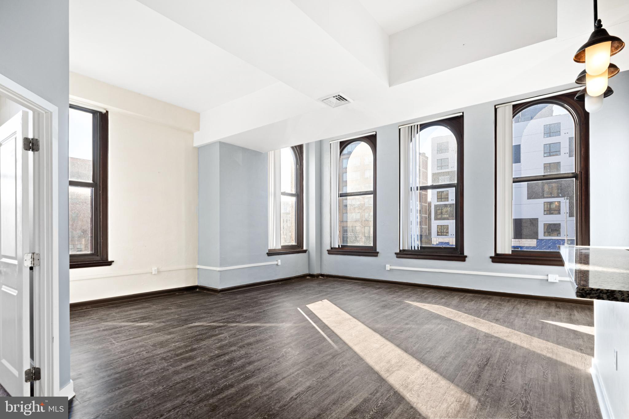 Discover Historic Charm and Modern Living at Mural Lofts
Welcome to Mural Lofts, where history meets contemporary living in the heart of Philadelphia. Located at the corner of Broad and Spring Garden, this stunning five-story building has been transformed from the historic Thaddeus Stevens School of Practice into distinctive loft apartments that blend timeless architectural details with modern comforts.
Key Features:
Unique Loft Apartments:
Each unit showcases the building’s original charm, including high ceilings, expansive windows, and intricate architectural details that set Mural Lofts apart.
Prime Location:
Situated at the gateway to the North Broad Corridor, Mural Lofts is just a few blocks from City Hall, putting you within walking distance of some of Philadelphia’s best dining and entertainment. Convenient access to public transportation makes exploring Center City effortless.
Historic Redesign:
This thoughtful redevelopment preserves the character of a landmark building while delivering all the amenities you need for modern urban living.
Come see why Mural Lofts is the perfect place to call home! Experience the unparalleled charm and convenience of living at the crossroads of history and contemporary Philadelphia.