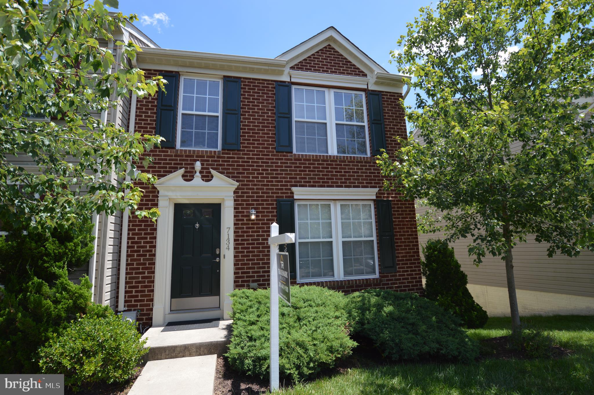 Super sharp END-unit BRICK-front townhome in VILLAGE TOWNS. The entire first level, stairs, and bedroom level landing area has newly installed exotic KEMPAS solid hardwood flooring. All new brush nickel hardware and lighting throughout with added recessed lighting in living room area. This townhome is light filled!!!! The kitchen features new LG STAINLESS STEEL appliances, beautiful cream/tan GRANITE countertops, and tan TRAVERTINE stone backsplash. There's a large deck off the kitchen/dining room area facing the woods. The upstairs features three bedrooms and two full bathroom. The master bathroom includes a large soak tub and shower. This bathroom has been renovated with gray/tan TRAVERTINE Stone and a solid glass shower door. The basement has a finished recreation area with a walkout to a wooded rear yard. This is absolute 10++++. You won't find quality finishes like this anywhere!!!!