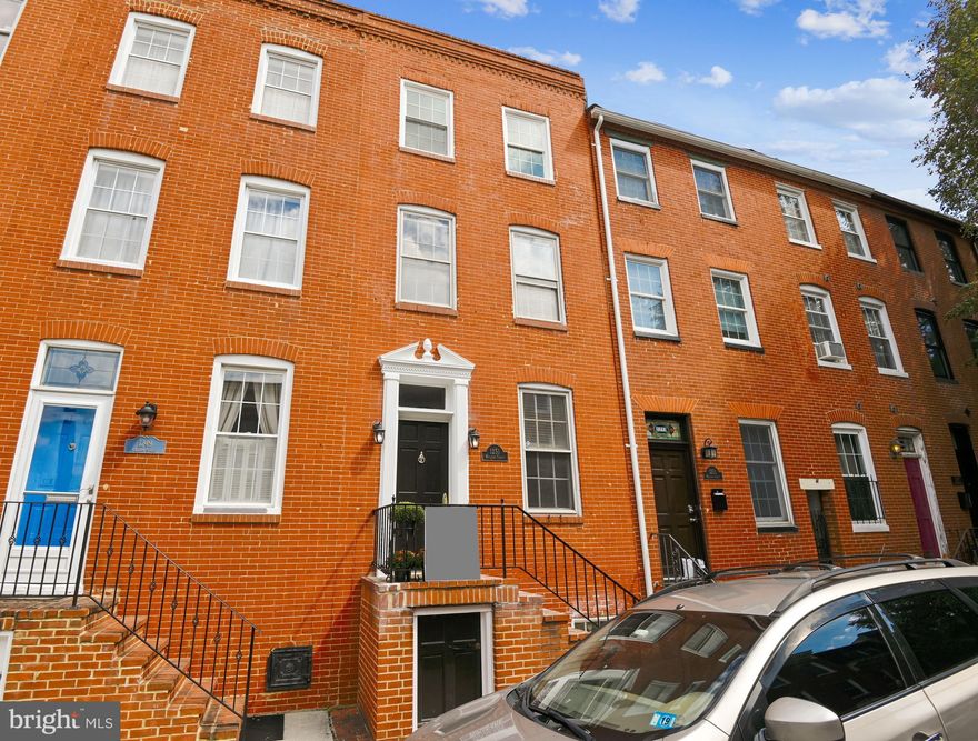 Price adjustment!  This beautiful home is located on William Street in the heart of Federal Hill.  Come see this 1900's home with the updates of today but orginial features of yesteryear!  The first floor boasts hardwood floors, a gas fireplace, glass block windows, orginial brick wall, a half bath, kitchen with stainless and granite and a 3 season sunroom.  The second floor has two large bedrooms, hardwood floors, large bath with a large closet. The third floor has another two bedrooms, full bath and access to the deck.  It could be a perfect roommate situation.  Also included is a newer HVAC System, newly coated roof, unfinished basement with plenty of storage and access frontage to the street! And did I mention parking!  Yes, a parking pad for one!
1251 William is convenitely located and walking distance to Cross Street Market,  Mother's Tavern, Ace Hardware and much much more! Come make this house your home!  For your convenience - some pictures have be digitally enhanced and staged.