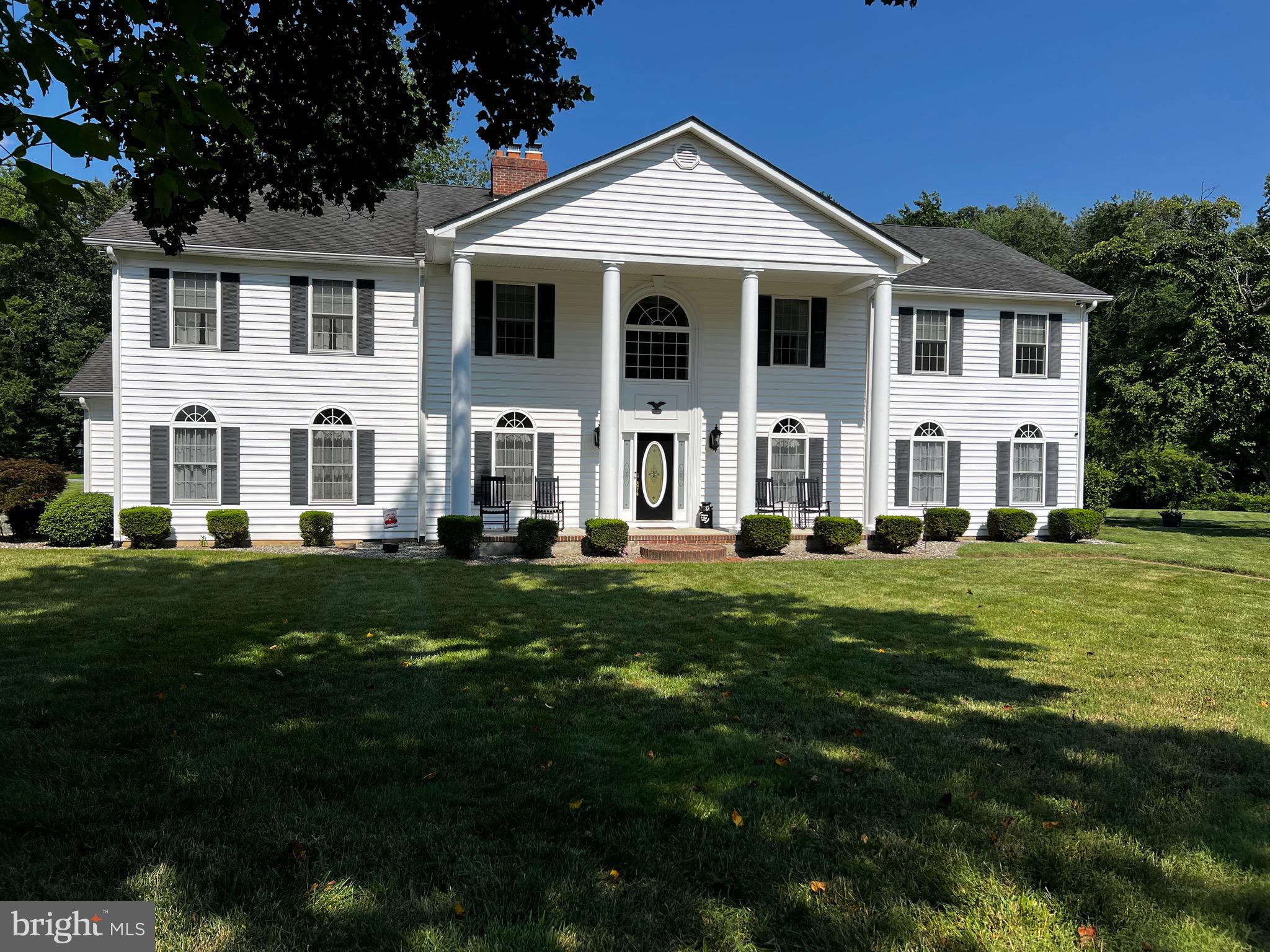 This estate is a rare offering, combining gracious Colonial architecture with state-of-the-art amenities and an abundance of space, inside and out. Whether you’re seeking a private sanctuary, an entertainer’s paradise, or a multi-generational family home, this property offers a lifestyle without compromise. Nestled in a serene and private setting on just over 43 acres, this stunning Colonial home embodies the perfect blend of classic charm and modern luxury. With five spacious bedrooms, three full bathrooms, and a dedicated office, this residence offers ample space for family, entertaining, and working from home. Step inside and discover a sunroom bathed in natural light, a comfortable living room, a welcoming family room, and a formal dining area ideal for gatherings. Each space flows effortlessly, creating an inviting atmosphere throughout the home. The heart of the home is the expansive kitchen, thoughtfully designed for both practicality and style. Highlights include, Large central island (perfect for meal prep and casual dining), Pot and kettle filler for added convenience, Six-burner gas cook top to satisfy any chef’s ambitions, Double wall electric oven with air fryer functionality, Full-size freezer and refrigerator, Hot water dispenser for instant beverages. Adjacent to the kitchen, a dedicated pantry provides additional storage, making entertaining a breeze. Car enthusiasts and hobbyists alike will appreciate the abundance of storage and work areas: Attached two-car garage with an integrated storage room, Detached five-car garage, 60x40 garage, (ideal for oversized vehicles or equipment), 72x35 pole barn with 6 bays and a drive-thru access for RVs and trailers, Sprawling 60x80 finished building with a 12’ wrap around porch, perfectly suited for entertaining large groups. For your outdoor entertainment, enjoy al fresco dining and gatherings under the pavilion, equipped with twelve picnic tables, ceiling fans, and lighting for comfort at any hour. The walkway seamlessly connects the house, pool, and pavilion, with a firepit serving as a cozy centerpiece for evening get-togethers. The property boasts a sparkling swimming pool with a thrilling slide and diving board, ideal for summer fun. Three decks—one off the primary bedroom and the other two off the kitchen—offer tranquil spots for morning coffee or unwinding in the hot tub. The basement provides abundant storage for all your needs. Retreat to the spacious primary bedroom, complete with private deck access. The primary bath features a walk-in shower with body jets and a two-person soaking jetted tub with heater, creating a spa-like sanctuary within your own home. Guests or extended family will appreciate the fully equipped in-law suite. It includes: Full kitchen, Full bath, Living room, Bedroom with walk-in closet. The home is also equipped with a whole house generator for peace of mind. There is also a stream on the property, chicken coop with a goat pen and a leased cell tower, providing a reliable income stream for at least 29 more years. Call today for your private showing!