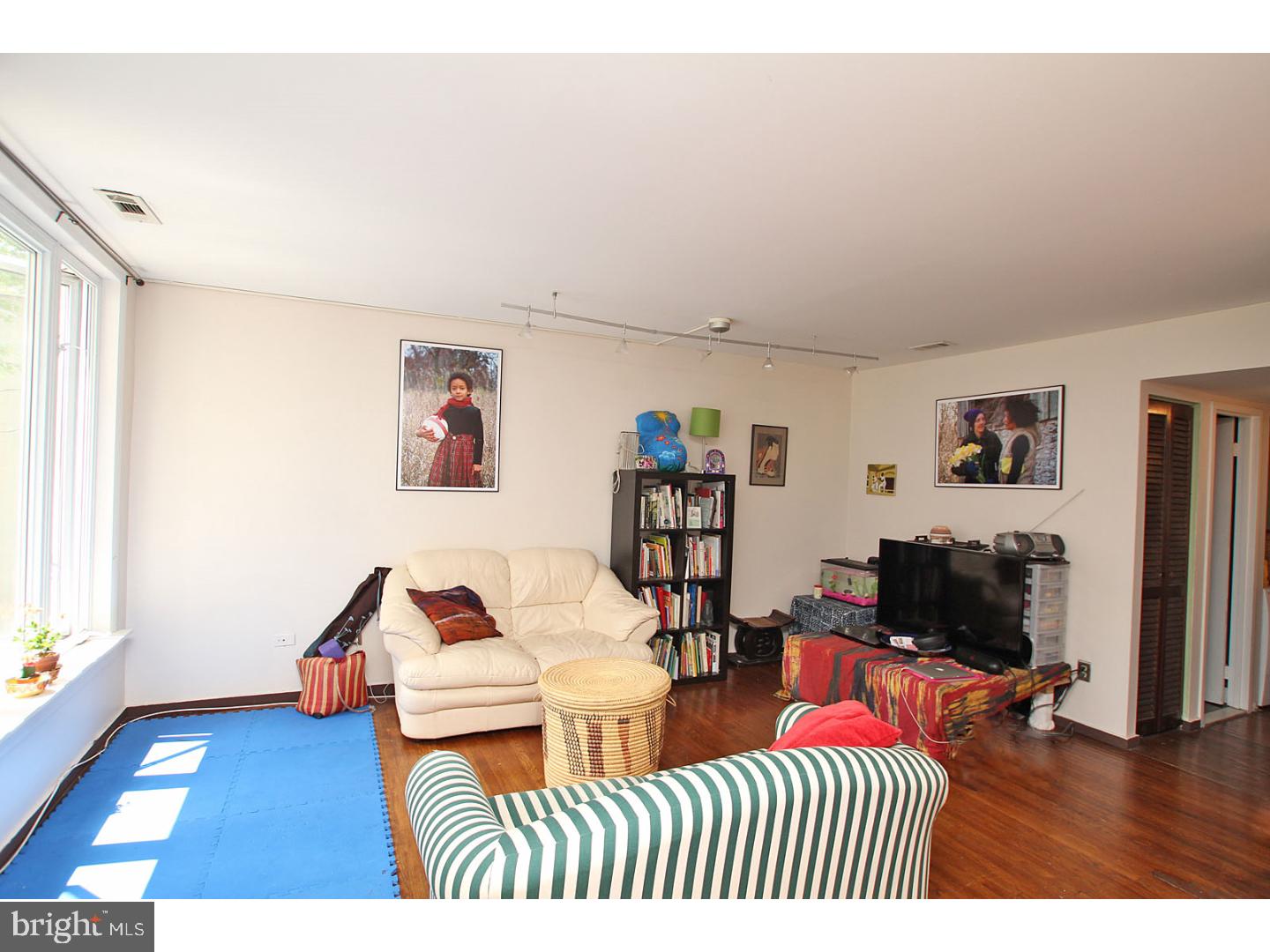 Come see this beautiful condo in the heart of one of Philadelphia's favorite neighborhoods- Queen Village! This second-floor unit features recent renovations, including granite countertops and stainless steel appliances in the kitchen, as well as gleaming hardwood floors throughout. Tons of windows in every room bring beautiful light into your new home, including two spacious bedrooms. The open main area offers space enough for a living room and dining area. The full bath offers beautiful tiled floors and modern fixtures. There is even designated basement storage and your very own washer/dryer in the unit! The windows overlook an incredible community garden and a beautiful, tree-lined street. You can enjoy the peace and quiet of a residential block while being within walking distance of all the shops, restaurants, cafes, and other amenities that your picturesque neighborhood has to offer. First month's rent, last month's rent, and one month's rent security deposit due at signing.