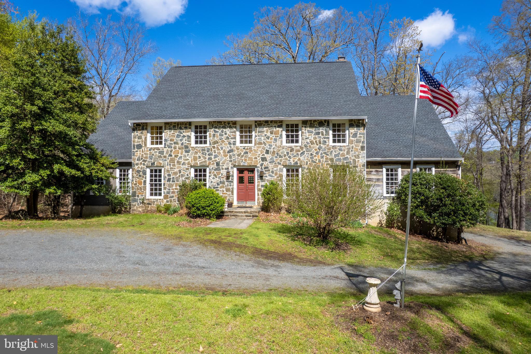 FABULOUS NEW PRICE!! An extraordinary opportunity to own a premier 3.12-acre estate with over 200 feet of private direct Potomac River access. This home offers a rare combination of privacy, natural beauty, and endless waterfront enjoyment. Nestled in the heart of Great Falls, this exceptional property provides breathtaking, year-round river views and a direct connection to nature, perfect for kayaking, canoeing, or simply taking in the serene surroundings.
At over 8,100 square feet, this custom Pennsylvania Bluestone home, built in 1988, is ready for transformation, offering limitless possibilities to create a showstopping luxury retreat. Expansive rooms, soaring ceilings, and a thoughtfully designed layout maximize both space and light. The upper level features five bedrooms, including a grand primary suite with panoramic river views. The main level has a wing with additional bedrooms complete with ensuite bathrooms perfect for in law, au pair or potential additional office space. A formal dining room, and a spectacular great room with a fireplace and a deck overlooking the water all are perfect for seamless indoor-outdoor living. The open-concept kitchen and family room, complete with a fireplace, provide a warm and inviting space for gatherings.
The lower level is designed for convenience and adventure, featuring a walkout to built-in river steps, a spacious bedroom, and ample storage, including dedicated space for kayaks. With its unrivaled setting and boundless potential, this estate is a rare gem, promising an unparalleled waterfront lifestyle just minutes from the heart of Great Falls.