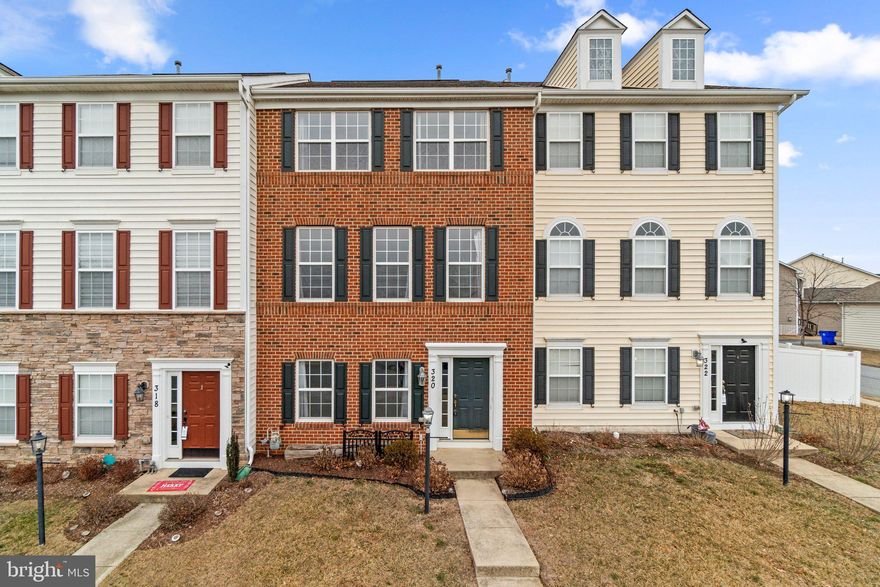 This stunning brick-front home in New Market, MD, offers 4 bedrooms, 3.5 baths, and a rear-entry 2-car garage. The main level features gleaming hardwood floors, while the kitchen boasts 42" maple cabinets, granite countertops, a gas range, and stainless steel appliances. A two-sided gas fireplace creates a warm and inviting atmosphere in both the living and dining areas. The spacious primary suite includes a walk-in closet and a luxurious bath with a soaking tub and separate shower. A front-loading, extra-large capacity washer and dryer add convenience on the top floor. The home also features a beautifully updated rear deck, perfect for BBQs, outdoor dining, and entertaining. Overlooking open green space in the front, this home is ideally located near schools, parks, shopping, and major commuter routes. Move-in ready and waiting for you to call it home.