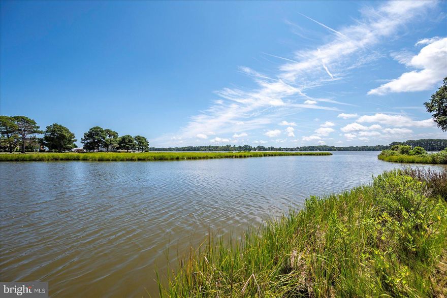 This rare opportunity offers the chance to own a waterfront home in one of the most sought-after coastal neighborhoods. Located in Holiday Harbor with no HOA fees and close proximity to Ocean City, MD, this one-of-a-kind property promises to hold its value for years to come. Perched on land with wrap-around waterfront access, this home offers direct entry into the tranquil waters of St. Martin’s Neck River. When the road traffic gets heavy...no worries here! This property offers just a quick ten-minute boat ride to the joys that the resort town of Ocean City brings. With both backyard and side yard water access, this is an absolute perfect opportunity for boating enthusiasts. Whether you’re navigating through the waterways or simply appreciating the water views from the backyard, this home is without a doubt a perfect blend of comfort and coastal charm. The real gem is the land and location, but the house itself offers great potential. Featuring one level of living space, three bedrooms, and an abundance of natural light pouring in from southern-facing windows and two balconies, the possibilities are endless for a buyer ready to customize or remodel. This is a true diamond in the rough, ready for a personal touch but offering a lifestyle that is second to none. Don’t miss the opportunity to create your ideal waterfront retreat.