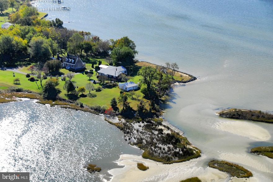 Panoramic sunset views with waterfrontage on the Potomac River and Calvert Creek.

 Lovingly owned by the original local family for over 50 years. Solid all-brick home featuring replacement windows and a durable metal roof. Large, functional kitchen with abundant cabinetry—ideal for cooking for  family gatherings. Situated on  2  acres with approximately 200 feet of riprap on the Potomac and over 800 feet of frontage on Calvert Creek. Steps to the beach. Convenient access to restaurants and marinas by boat or car. Enjoy boating, crabbing, oyster harvesting, and fishing right from your doorstep.