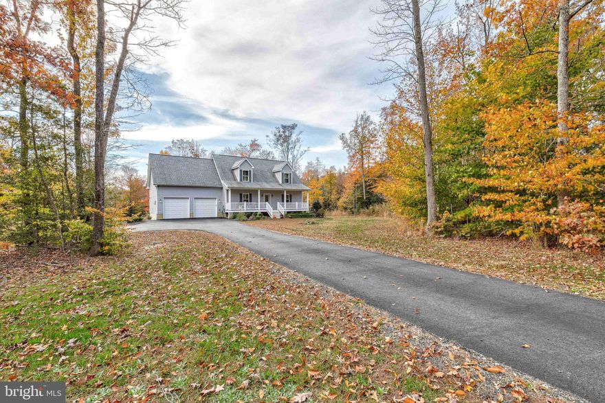 This charming Cape Cod built with an attached, oversized 2 car garage, and walk-out basement is just like new and ready for your personal touches!

With a partially-cleared 4.55 acre lot, you’ll find plenty of space to stretch your legs and enjoy your favorite outdoor hobbies.

Entering the home on the main level, you are greeted by an impressive rod-iron staircase decorated with modern light fixtures. Headed to the left from the main entrance, you’ll find an open-concept living area with a family room space with recessed lighting, and custom interior shutters. Connecting the family room to the kitchen is a dining area which has an entrance to the garage, as well as a windowed-door out to the spacious trex deck with vinyl railings. Also attached to the dining area, is a modern kitchen, featuring a large island, marble countertops, stainless steel appliances, and a pantry w/ sliding barn-door. A functional half bath can also be found on this level.

Headed to the right from the main entrance, you come upon a main-level master bedroom with en-suite. The en-suite bathroom includes dual vanities, a ceramic tile shower with two shower heads, and a walk-in closet. 

Upstairs you find 3 additional bedrooms with ample closet space.  Down the hall, there's a full bathroom with a dual-sink vanity, a shower tub combo, a large linen closet,  and a door to separate the bathing area.

Following the stairs down from the living room to the unfinished basement, you’ll find an additional 1,064 sqft; ready for your customization! A sump pump is installed to ensure dry conditions. Two egress windows are installed in preparation to add another bedroom, as wells as rough-ins plumbed for adding another bathroom to the basement. Below the stairs you will find a water tank for the house’s sprinkler system.