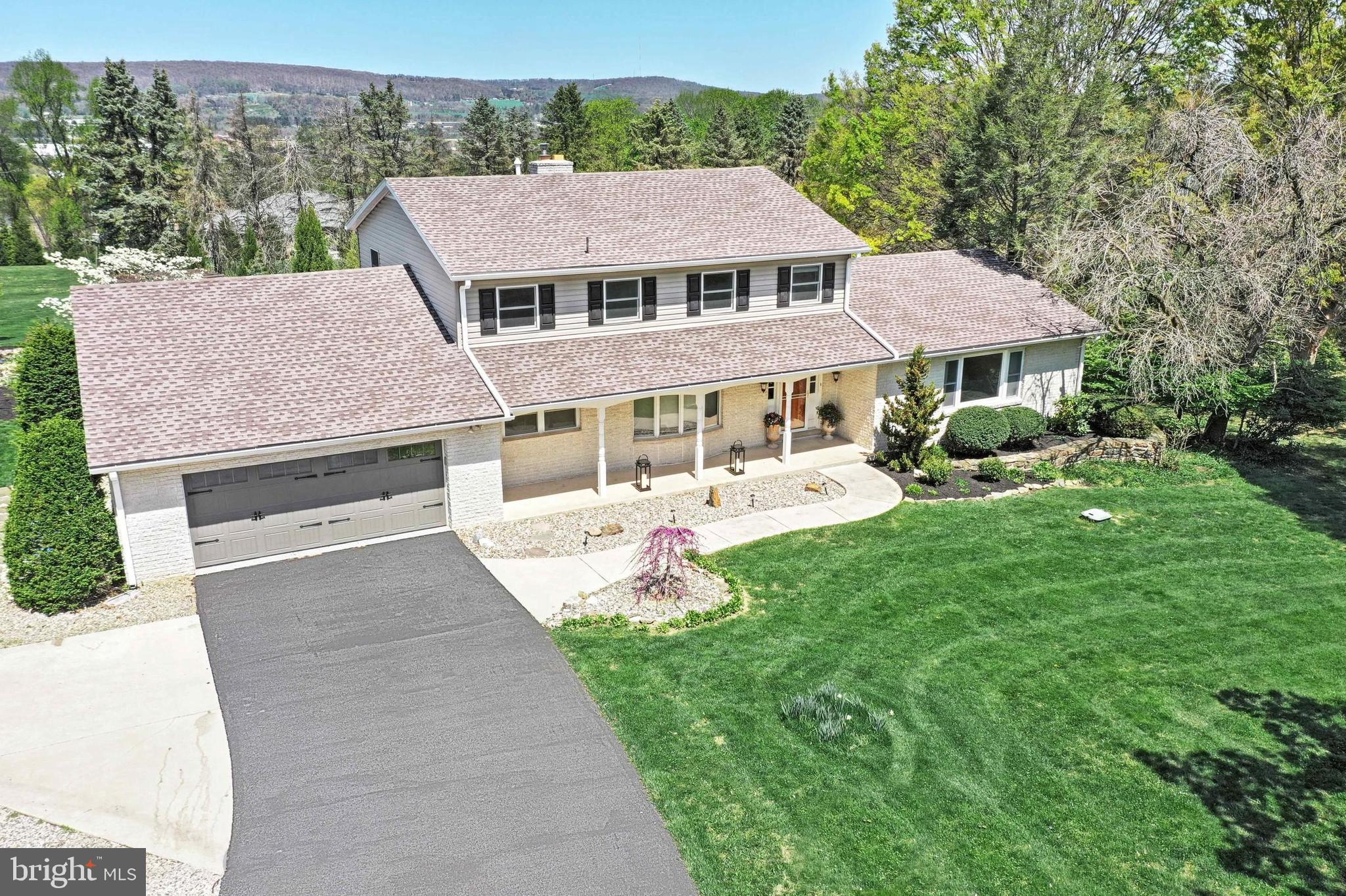 Come check out this wonderful home located on a private lane with 2 acres of park like setting. Central York School District! This home includes a first floor master suite and is ideal for indoor and outdoor entertaining. The expansive patio includes a large Koi pond with waterfall feature and beautiful pergola. A swimming pool and lower level patio also contributes to the wonderful backyard setting. The bright and open main floor layout includes a master suite with a 12 x 5 walk-in closet with built in shelving, and full bath with luxury walk-in shower. The open kitchen and dining room layout opens up to a spacious family room featuring a wood burning fireplace. An enclosed patio is great for entertaining all year round with wonderful views of backyard landscape. The upper level includes four nice sized bedrooms and full bath, ideal for the growing family. Don’t miss out on the lower level with a spacious finished family/game room, workshop area, and bonus room that could easily be used as an additional bedroom, office, or recreational room. You don’t want to miss out on all of the wonderful amenities this home has to offer!