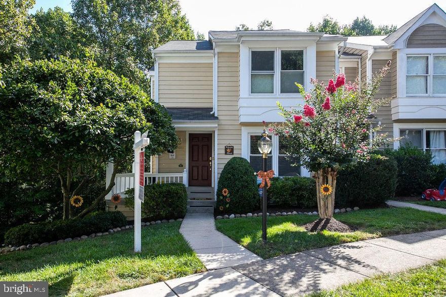Large, light-filled end unit with charming front porch in one of Reston's most sought-after neighborhoods...walk to elementary school, pools, tennis and North Point Village shopping center. Updated kitchen and master bath, wood floors main. New roof, HVAC, washer/dryer, most kitchen appliances and new granite installed. Majority of doors and windows upgraded to Thompson Creek.  Lower level with walk-out to new expanded deck backs to trees. Security system by ADT installed in 2016. This is a great house, with lots of updates and improvements in a fabulous location and community and just minutes to the Fairfax County Parkway, Lesburg Pike, Reston Town Center and metro!