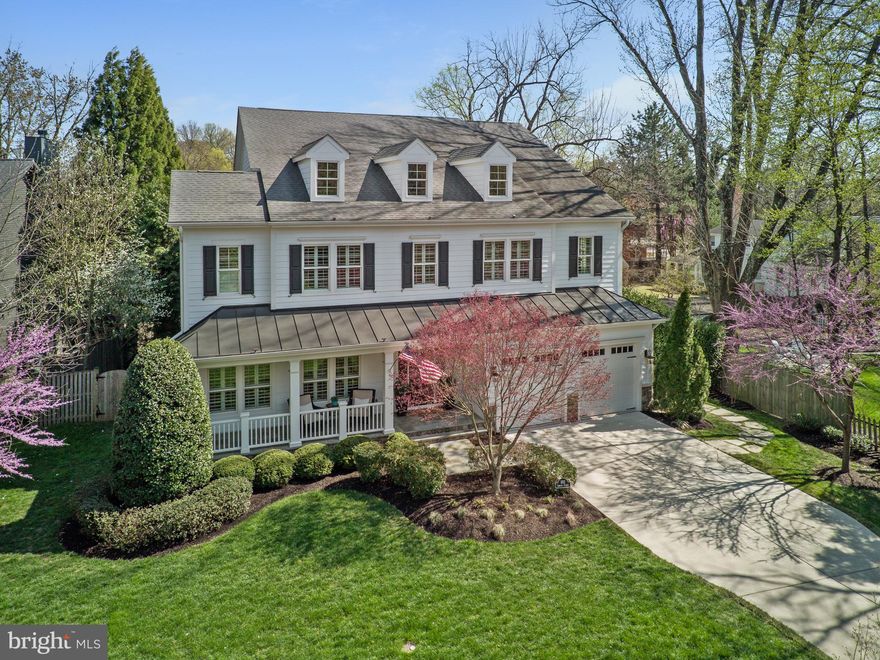 An exceptional custom-built trophy home with a private heated saltwater swimming pool and spa in prime downtown City of Falls Church. Just 350 yards from the brand-new Whole Foods on E Broad St, this meticulously designed 5-bedroom, 5.5-bathroom residence with two car garage, spans over 7,000 square feet of immaculately finished living space. Perfectly situated on an impeccably landscaped .3 acre lot, offering unparalleled luxury and convenience. The main level boasts impressive 10-foot ceilings, oversized 8ft custom doors, hardwood floors throughout and ceiling speakers for surround sound. A stunning family room provides coffered ceilings, a gas fireplace, and elegant crown moldings, with a perfect view of the private pool and spa. The designer chef’s kitchen is expansive, featuring an oversized central island with beautiful leathered granite, a walk-in pantry, and top-of-the-line appliances, including a Wolf range top, Wolf double ovens with a separate steamer, dual Fisher Paykel dishwashers, and a Sub-Zero refrigerator. A separate bar area, complete with an under-counter ice maker and wine cooler, is perfect for entertaining, especially with the adjacent screened-in porch featuring a double-sided gas fireplace and mounted flatscreen TV. Just off the screened-in porch lies one of the home’s most impressive features—a heated saltwater inground swimming pool with a spa, surrounded by a spacious paver pool deck offering ample room for lounging, outdoor dining, grilling, and cozy evenings around the fire pit. The formal dining room offers a sophisticated space for gatherings. A spacious main-level bedroom with an en-suite bathroom provides flexibility as either a guest suite or an executive office. Additionally, a well-appointed mudroom includes a washer and dryer, offering added convenience after a day by the pool, while easy access to a powder room and a large two car garage complete this level. The upper level is equally impressive, featuring a luxurious primary suite with a spa-like en-suite bathroom, dual walk-in closets, and a private screened-in porch overlooking the pool and backyard. Two additional generously sized bedrooms, each with en-suite bathrooms, and a second laundry room enhance the functionality of this level. The lower level offers abundant space, including a large recreation room with direct access to the pool, a guest bedroom with an en-suite bathroom, a fitness center spacious enough for a complete gym setup, and a large utility room. This home’s prime location ensures seamless access to shopping, dining, and the renowned Saturday morning farmers market. Outdoor enthusiasts will appreciate proximity to the WO&D bike path, while commuters will benefit from easy access to two Metro stations, Reagan and Dulles Airports, and major routes including I-66, I-495, Route 7, and Route 50. Additionally, the nearby Founders Row development will soon feature a movie theater, further enhancing the vibrant community experience. Don’t miss this rare opportunity to own one of the very rare trophy homes in downtown City of Falls Church.