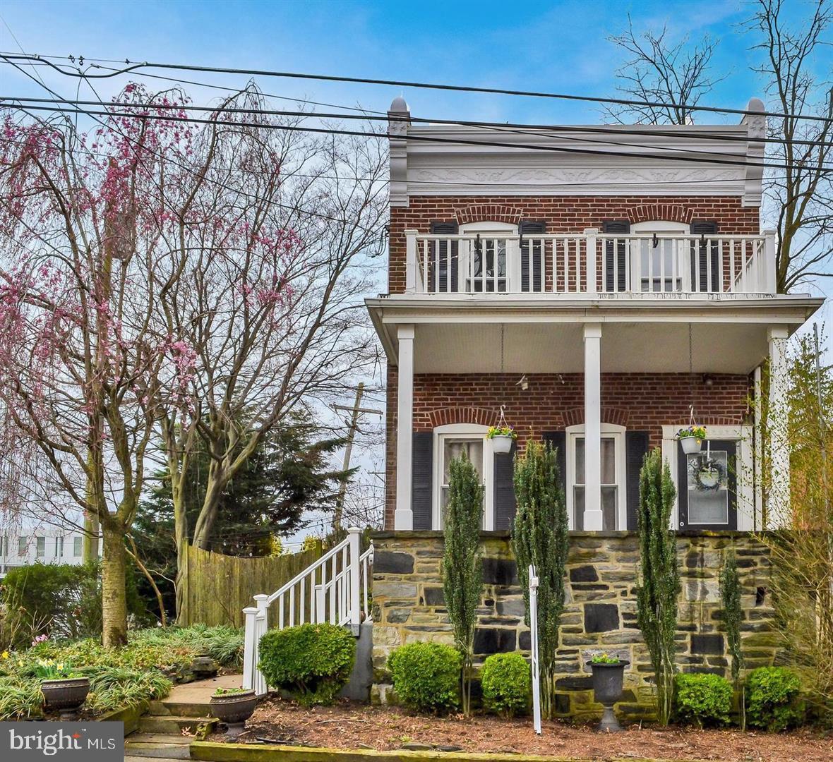 Nestled within the beating heart of Delaware county in the borough of Media is this must-see single-family home. Bright and inviting with a charming front porch and gardens, you’ll feel at ease from the moment you arrive. Inside, the layout is light-filled and elegant with on-trend flooring underfoot and a sophisticated color palette. There are seven rooms in total including a living room and a dining room that opens into the newer kitchen. Here, the budding chef is treated to a suite of stainless steel appliances, a farmhouse-style sink and plenty of storage within the shaker-style cabinetry. A den is warmed by a cozy fireplace, the three bedrooms are all a great size and there are 2.5 bathrooms for added comfort. Outside, there are two patios to choose from ensuring plenty of space when it’s time to host friends. A detached two-car garage features a loft and the yard is fenced for added privacy.