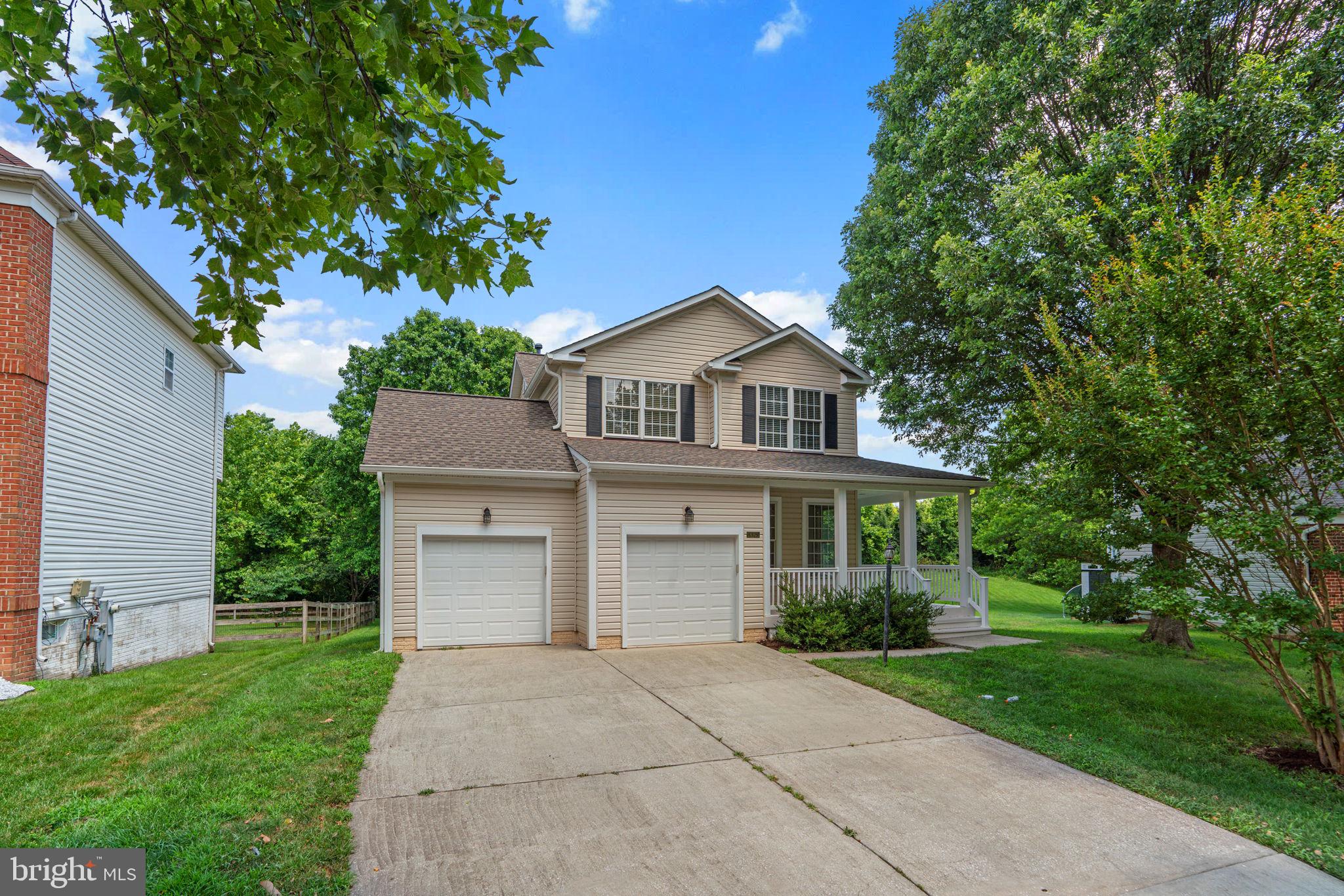 Fabulous Columbia home backing up to trees and the Kendall Ridge loop. Step onto the wraparound front porch and you can immediately imagine spending summer here! Fabulous floor plan and neutral walls throughout. Main level offers hardwood floors in the living and dining rooms, an updated kitchen with quartz countertops, breakfast bar and stainless steel appliances, a family room with gas fireplace and marble surround, a huge Florida room, half bath, and laundry. Upstairs features four bedrooms with ceiling fans and wall-to-wall carpeting. Primary suite with vaulted ceiling, walk-in closet, soaking tub, updated vanity, and walk-in shower. Finished lower level includes a large recreation room, office, half bath, and utility room. Enjoy outdoor living on the composite deck overlooking the expansive and flat yard. The backyard is gigantic with plenty of space so bring your creativity. Oversized two car garage.
