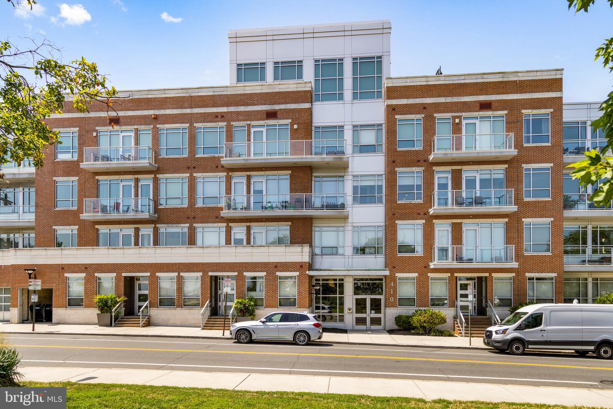 Don’t miss this rare opportunity to own a stunning 2 bedroom 2 bath with den/office, turnkey residence in the coveted 410 at Society Hill community. Combining peaceful surroundings with the vibrancy of Center City, this sophisticated two-bedroom, two-bathroom condominium offers luxurious upgrades, ample space, and exceptional amenities in an ideal upper-end unit location.
Spanning 1,531 square feet, this residence features soaring 10-foot ceilings with recessed and designer lighting, rich wide-plank hardwood floors throughout, solid-core doors, and wide baseboards. Oversized windows with custom electric treatments flood the space with natural light and offer captivating views of the skyline and Head House District.
The spacious great room provides a generous area for living and dining, while the open gourmet kitchen is a chef’s dream. It boasts painted soft-close maple cabinetry, quartz countertops, marble subway-tiled backsplashes, and upscale Gaggenau Professional stainless steel appliances—including a 5-burner gas cooktop, convection oven, large refrigerator-freezer, dishwasher, and built-in microwave drawer. A wide island with a breakfast bar is perfect for casual meals, with adjoined balconies offering serene, treetop views ideal for outdoor dining or morning coffee.
A large bonus room/den adjacent to the great room offers versatile space for a home office, media lounge, or third bedroom (easily enclosed with a wall). The owners’ suite is a private retreat with designer lighting, and another spacious balcony. The luxurious marble spa bath features an oversized frameless glass rain shower with Carrara marble details, a double vanity with ample storage, and a large custom fit-out walk-in closet.
The secondary bedroom enjoys excellent natural light, ample closet space, and access to a beautifully appointed hall bathroom with a deep soaking tub and Carrara marble subway tiles. Additional features include a convenient full-sized in-unit washer-dryer, assigned garage parking with storage, and a pet-friendly environment.
Residences at 410 Society Hill offer resort-like amenities, including 24-hour concierge, controlled gated access, video security, underground parking, a community room, lush courtyard with outdoor seating and reflecting pool, and a roof deck with 360-degree panoramic views of the river, city skyline, and fireworks displays.
Located in one of Philadelphia’s most historic and walkable neighborhoods, this home is just steps from fine dining, nightlife, shopping, and Head House Square. With excellent bike, walk, and transit scores, enjoy the suburban feel with all the urban conveniences at your doorstep.
This is a truly exceptional, move-in ready home — a rare gem at Society Hill.
