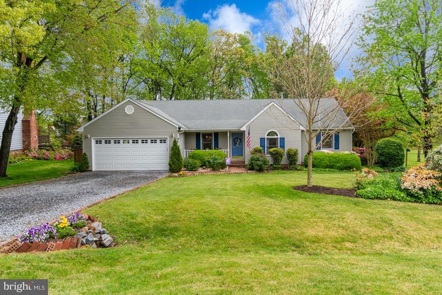 Absolutely beautiful 3 bedroom and 2 bath home situated on a majestic park-like setting in a super convenient location.  This home features a split bedroom and open floor plan and includes a fabulously spacious family room with a cozy wood burning fireplace.  The master suite is also spacious and includes a deluxe master bath with a separate shower and tub.  The lot is super well landscaped and includes an inviting from porch and a large deck that is awesome for entertaining.  The large, level backyard yard is ready for people and animals of all ages to run, play, and dream the day away. Superb location, close to schools, shopping, dining, and commuting options. This home is clean as a pin and move in ready.  Come see it today!