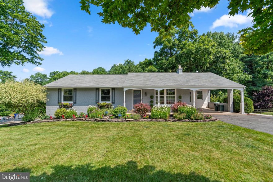 Stunning and meticulously landscaped, this rancher-style home offers over 2,500 sqft, 3 bedrooms, and 3 full bathrooms in highly desired Ellicott City. Step inside the spacious interior presenting gorgeous hardwood floors throughout the living room, formal dining room, kitchen, breakfast room with a gas fireplace, and sunroom through French doors with vaulted ceilings and skylights. The bright white kitchen is equipped with stainless steel appliances, marble countertops, and ample cabinetry. Additionally on the main level there are 3 large bedrooms and 2 full baths including a primary suite with two closets.

The partially finished lower level offers a full bathroom, laundry and storage space, and a large carpeted space for lounging or recreation with a wood burning fireplace, built-in cabinets, and slider access to the backyard. The home’s beautifully maintained exterior impresses with luscious landscaping and ample green space in both the front and backyards, a concrete patio, and a covered brick patio. This highly sought-after location is minutes from commuter routes, Patapsco State Park, dining, shopping, and Historic Old Ellicott City Main Street.