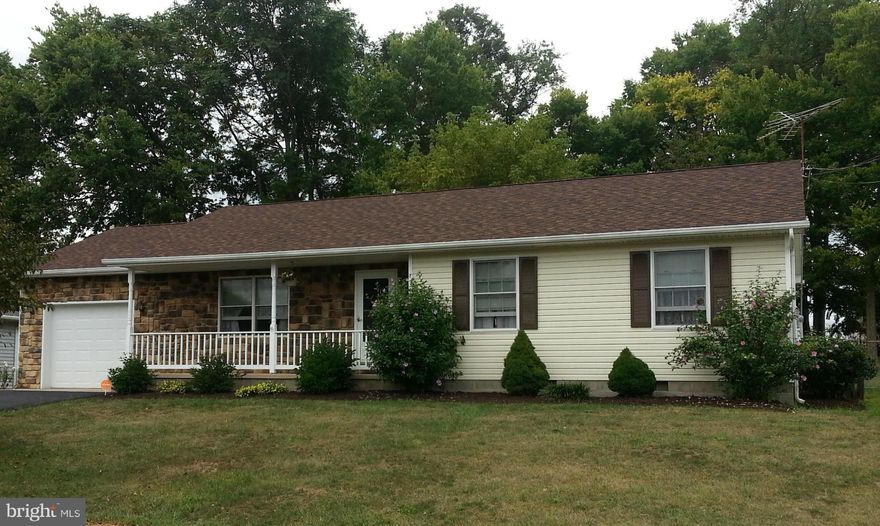 Charming rancher with mature trees in chain-link fenced back yard.  Move-in ready in excellent condition. Three bedrooms, two full baths with all appliances including water softener, alarm system.  New laminate floor in living room with gas fireplace. Attached garage & rear deck.  Newly-paved driveway.  Walk to schools in Musselman district.  Quiet subdivision close to I-81, Exit 5 in Inwood, WV.