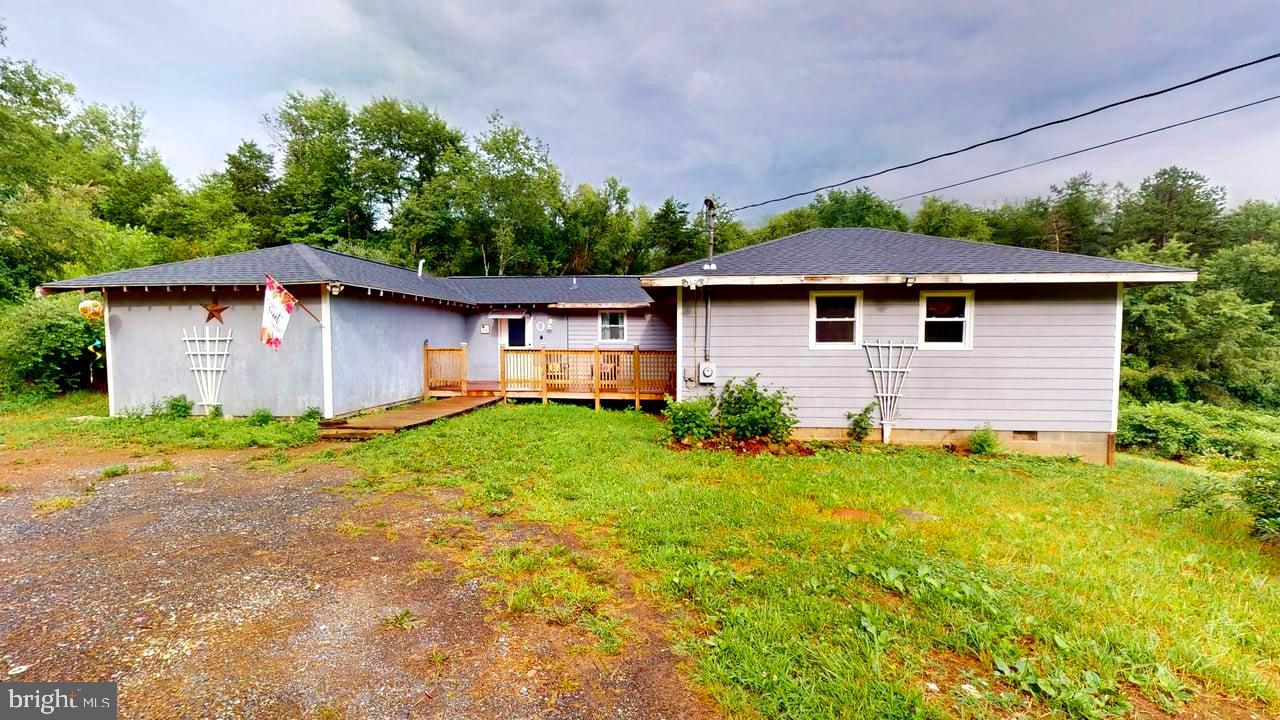 Discover peace and privacy in this updated 4-bedroom, 2-bath rancher nestled on five unrestricted acres! This home offers the perfect blend of rustic charm and modern comfort. Step inside to find an updated interior featuring new luxury vinyl plank flooring, a cozy rustic-style kitchen with modern touches, and spacious living room right off the kitchen. Enjoy year-round comfort with a brand-new roof, new heat pump, and two newly installed mini splits! The home also boasts a brand-new deck ideal for relaxing or entertaining along with new windows that enhance energy efficiency and views of your private surroundings! While this home is full of potential and many major updates are complete, some areas still need work! Making this a great opportunity to customize this home with your own finishing touches! Whether you're looking for a peaceful retreat, space for animals or gardening, or just room to breathe, this home offers endless possibilities. Just a short drive from town amenities! 45 minutes to Winchester VA!