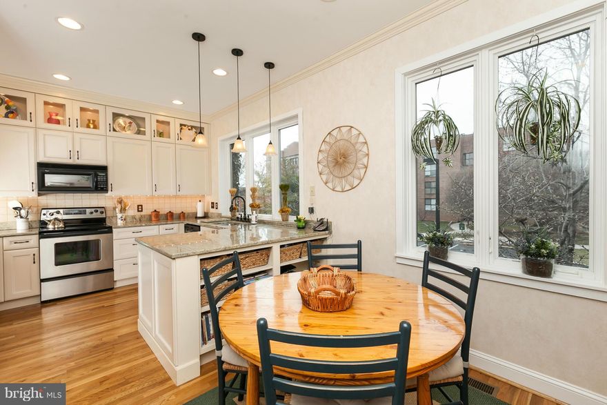 The urban oasis in the heart of Federal Hill. Grindall's Yard garage townhome. Main level family rm, powder rm,  laundry center and double set of sliders leading to lovely shady brick patio. Upper level features stunning newly renovated eat-in kitchen, pdr rm, separate dining rm could seat twelve. Living room with cozy FP and double french sliders leading to deck and view of European style mews