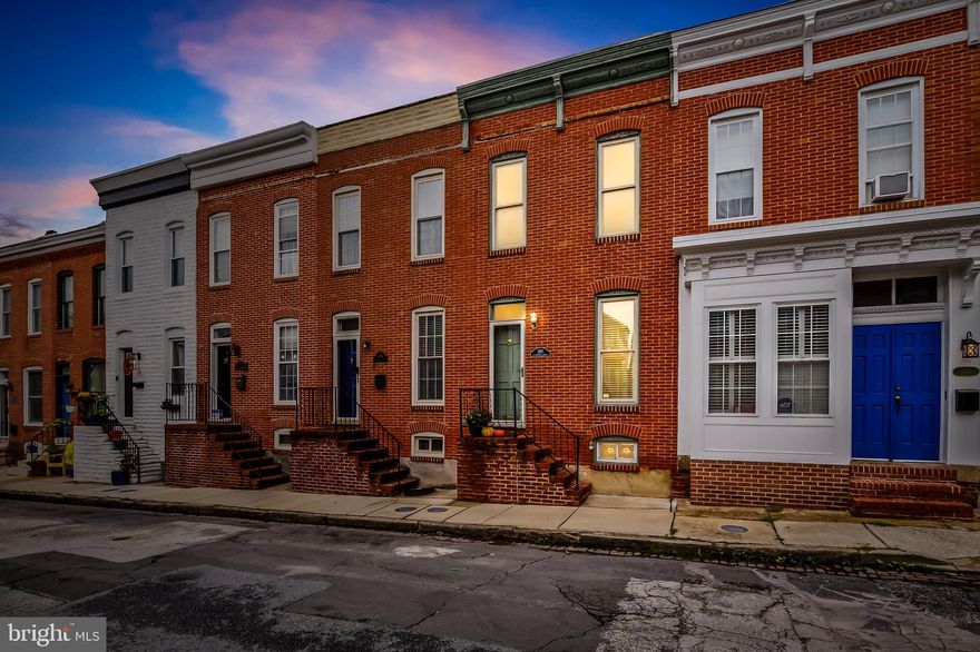 Welcome to this Federal-style townhome nestled on one of the most picturesque streets in the heart of Federal Hill. This prime location puts you within easy walking distance to iconic attractions, including both stadiums, an array of restaurants and bars, and the vibrant Cross Street Market. The home has been thoughtfully updated with modern renovations, including gleaming new stainless steel appliances in the kitchen, fresh paint, plush new carpeting, and essential electrical upgrades throughout. With 2 spacious bedrooms, 2 full bathrooms, and the rare convenience of a private parking pad, this townhome is perfect for an owner-occupant seeking the charm of city living, or an investor looking to expand their portfolio. As you step inside, you'll be greeted by an inviting living room featuring rich hardwood floors and an abundance of natural light. The separate dining area is ideal for hosting friends, offering a dedicated space for memorable meals. The large kitchen boasts ceramic tile floors, stainless steel appliances, and enough space for a cozy breakfast nook. Upstairs, both bedrooms come complete with their own en-suite bathrooms, offering privacy and comfort—perfect for guests or roommates. The unfinished basement provides ample storage and the opportunity to customize the space to your needs. This charming home offers endless possibilities to add your personal touches and truly make it your own. Don’t miss out on this exceptional opportunity—schedule your showing today!