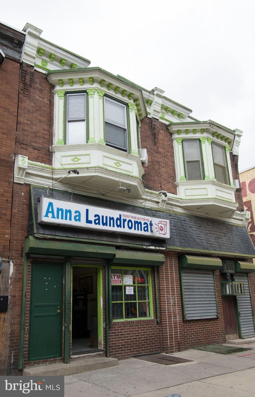 High return, fully leased, mixed use Building in West Philadelphia with the massive commercial space rented to an owner-operator laundromat. Enter this huge, almost 4600 square foot building and all you see is machines everywhere. It is well laid out using all space available. There is also a small store selling soap, candy, sodas and more. A convenient powder room is also contained on the 1st floor. The upper floors house 2, roomy 2-3 bedroom apartments, 1 to the owner of the laundromat, and the other apartment is rented retail for $900.00/ month. The laundromat and 1 upstairs apartment are leased for $1,100.00/ month, but it is grossly under rented. The basement has all back up laundry equipment, storage and multiple concrete columns to support all of the machinery. This is a turnkey investment with a Fantastic return needing minimal TLC. Financial details available upon request.