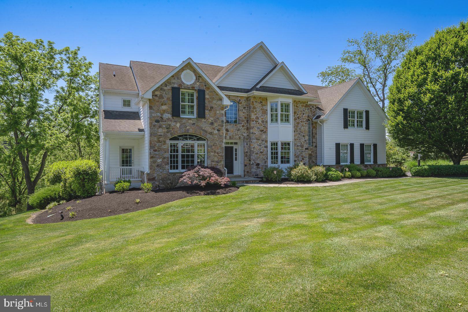 Welcome to 1729 Towne Drive an exquisite stone front estate home situated on a premium, private lot in the sought after community of “Clocktower Woods” in East Goshen. Recently renovated on the exterior with new Alside Ascend composite siding (2021), this updated and tastefully appointed Chelsea model is the largest floor plan offered in Clocktower Woods with over 6,800 sq ft of fabulous living space on 3 three levels featuring 5 Bedrooms, 5 full Baths and 2 half Baths over 5,000 sq ft on the 1st and 2nd floors plus over 1,800 sq ft of additional living space in the professionally finished Lower Level. The fabulous Outdoor Living area provides an attractive extension of the main home featuring an oversized composite deck with breathtaking views of the magnificent private rear yard and acres of open space. Main Level features beautiful hardwood flooring, extensive custom millwork and an inviting front entry with transom windows and 2-story Foyer; Formal Living Room w/2 pc crown molding, triple feature window, recessed lighting & double French doors to the private Study offering custom built-ins, plantation shutters & exit to a cozy private front porch; elegant Formal Dining Room w/glass French doors, custom wainscoting & walkout bay window; beautifully renovated Gourmet Kitchen features custom Kountry Kraft ceiling height cabinetry, Thermador commercial gas range, Subzero refrigerator, custom tumbled marble backsplash, farmhouse sink, expanded center island w/pendulum lights and built-in microwave & trash compactor; adjacent to Kitchen is a separate sun-filled Breakfast/Morning Room & Butler’s Pantry area featuring custom built-in cabinetry & wood countertop; stunning 2-story Family Room showcases a gorgeous beamed ceiling, gas Fireplace & floor-to-ceiling windows. Mudroom w/custom lockers & storage drawers, Formal & Informal Powder Rooms & back staircase complete the 1st floor. 2nd Level features hardwood flooring in the hallway; Primary Bedroom Suite offers tray ceiling w/recessed lighting, separate Sitting Room w/windows on 3 sides (ideal as a 2nd home office) overlooking rear yard, 2 custom designed walk-in closets and renovated Primary Bath w/separate granite top vanities, claw tub, oversized shower w/2” waterline overhead rain shower & 2 separately controlled body jets; 4 additional generous sized Bedrooms, 2 with ensuite baths, plus a large renovated Hall Bath w/double vanities & tub/shower w/clear glass door; convenient 2nd Floor Laundry w/cabinetry & folding area plus back staircase to 1st floor. 2 separate stairway entries, one from the main Foyer area and one from the back entry area, lead to the professionally finished walkout Lower Level offering over 1,800 sq ft full sized Bar w/rich custom cabinetry, refrigerator & dishwasher; large Media/Entertainment Room w/gas fireplace & full sized windows; professional Gym w/rubber mat flooring & mirrors and separate private Game Room. Completing the Lower Level is a full Bath, Dressing Room & 2nd Laundry Room plus French doors to the rear patio area with Hot Tub. Additional amenities include 3-car garage w/solid wood carriage style garage doors, Garage Tek flooring & storage walls, new 1st Floor HVAC (2023), new 2nd Floor HVAC (2018), 2 new hot water heaters (2018), new roof (2014), plantation shutters & custom designer closets in all 2nd floor Bedrooms, updated interior doors & hardware, Generator servicing 1 full electrical panel, surround sound speakers throughout, front & rear yard LED uplighting, WiFi & cellular backup security system & inground sprinkler system. Don’t miss this gorgeous home located in the award-winning West Chester School District and close to the area’s finest private schools. Convenient to Malvern & Paoli train stations, the shops and restaurants of downtown Malvern, West Chester and the Main Line and the beautiful parks & trails of East Goshen Park & Applebrook Golf Club.