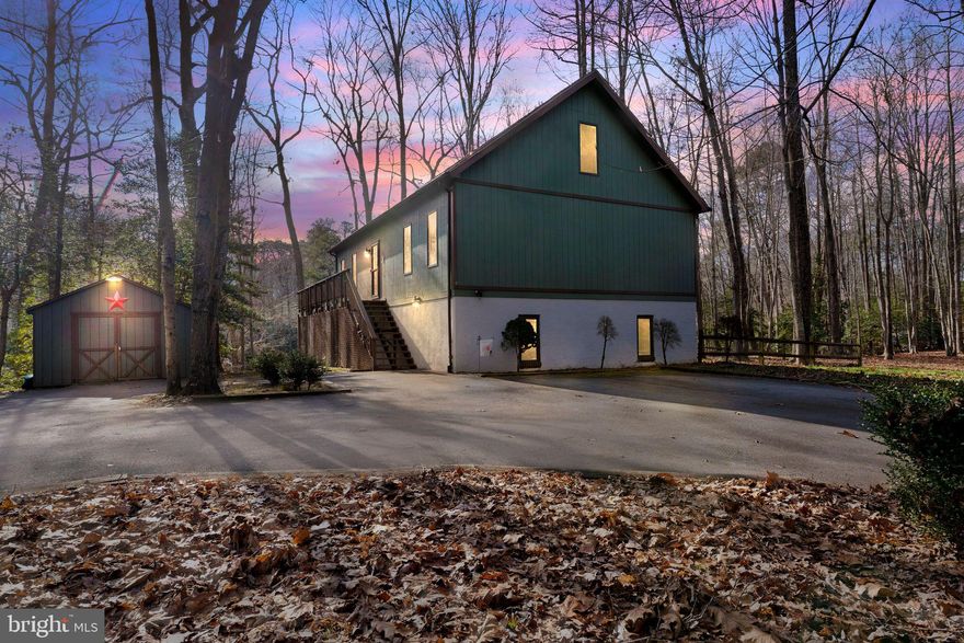 Welcome to this beautifully designed 4-bedroom, 4-bathroom contemporary home in Chesapeake Ranch Estates, Lusby, Maryland. Occupying three scenic lots, now combined into a spacious 1.3-acre property, this three-level home offers both privacy and stunning pond access. The architecture blends elegance with practicality, featuring cathedral ceilings, hardwood flooring on the main level, a carpeted upstairs loft, and luxury vinyl plank flooring in the basement.

Inside, the home is bathed in natural light through large windows, perfect for enjoying the serene sunrise and sunset. Each bedroom and bathroom, including a handicap accessible suite, ensures privacy and personal space. The lower level, designed for entertainment, boasts a large family and recreation room with a wet bar, leading out to a stone patio under the deck, complete with a hot tub.

 While enjoying the tranquility of a private, wooded setting, you're just a short drive from multiple shopping centers, dining scenes on Solomons Island, and  several schools. The property's outdoor appeal is further enhanced by its pet-friendly fenced yard, complete with a dog ramp and doggie door. Complementing the home, the outdoor shed, mirroring the house in color and style, is equipped with electricity, making it an ideal workshop or extra storage space. The highlight for nature lovers is undoubtedly the private access to the pond, featuring a pier and a stone stairway, ideal for wildlife watching and immersing in the serene surroundings.

As part of the Chesapeake Ranch Estates community, residents enjoy access to a lake, beaches, an airstrip, camping grounds, and garden areas. This well-maintained home is ready for new owners, offering a harmonious blend of secluded contemporary living, ample space, and community amenities. Don’t miss the opportunity to make this exceptional property your own