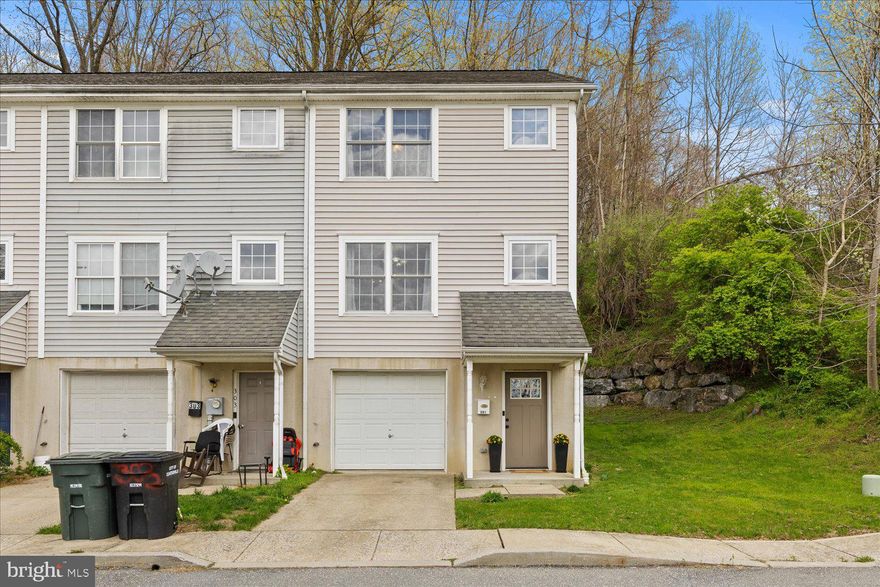 Tucked away at the end of the row, this inviting 3 bedroom, 1 1/2 bathroom townhome combines peaceful views with practical updates. Inside, you’ll find a freshly repainted interior and new flooring throughout offering a bright, clean feel from top to bottom! The main level’s open layout is filled with natural light, and the living area flows seamlessly onto a private wooden deck, perfect for relaxing or enjoying the view of your own wooded backdrop, covering over half an acre! Upstairs you'll find 3 spacious bedrooms with a spacious walk-in closet  in the primary. Both stairways have been refreshed with new paint, trim, and a runner on the upper steps for a beautiful finished, polished look! Additional highlights include a one car garage, a newly installed water meter (2023), and a brand-new front door (2025) that adds to the home’s curb appeal! Whether you’re looking for comfort, convenience or a bit of privacy in a serene setting, this home checks all the boxes! Schedule your private tour today!