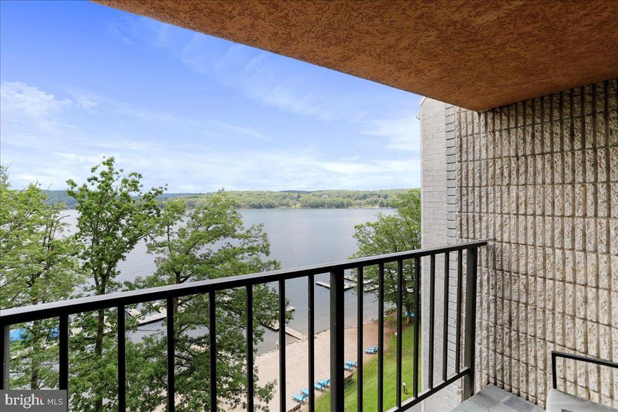 Welcome to Will O' the Wisp Condominiums, where premium upgrades meet penthouse-level lakefront living at Deep Creek Lake! This fully furnished, beautifully updated, rarely available, top-floor two-level condo features one bedroom and one bath, offering 550 square feet of comfort, charm, and versatility — perfect as a vacation home, year-round retreat, or income-producing rental.

Start your mornings with exceptional sunrises from your private lakefront balcony — one of the best views in the building! Inside, you’ll find brand-new luxury vinyl plank flooring, updated lighting, and a show-stopping custom staircase, which replaced the outdated spiral design and was so substantial it had to be hoisted into the condo via the roof — a true architectural centerpiece. This penthouse-style unit requires no steps as there's an elevator from the main level to the condo, offering rare convenience and accessibility and offers LVP wood floors, new lighting and soaring ceilings.

Currently operating as a successful short-term rental with Railey Vacations under the name "Anchors Away," this property has a proven rental history — offering an immediate opportunity for investment income with an Average Daily Rental of $199.65 and Annual Gross Income Potential of $27k to $35k.

Recent mechanical upgrades include a new HVAC system (2025), hot water heater (2024)— all the major updates are already done. The unit also includes covered garage parking, making life easier year-round.

Enjoy resort-style amenities including an indoor pool, hot tubs, fitness center, sauna, game room, private sandy beach, dock slip access through the HOA, and a fully serviced front desk for guest support and added security. All of this is just minutes from Wisp Resort, State Parks, and adjoining two fine dining restaurants — the perfect base for four-season fun at the lake.