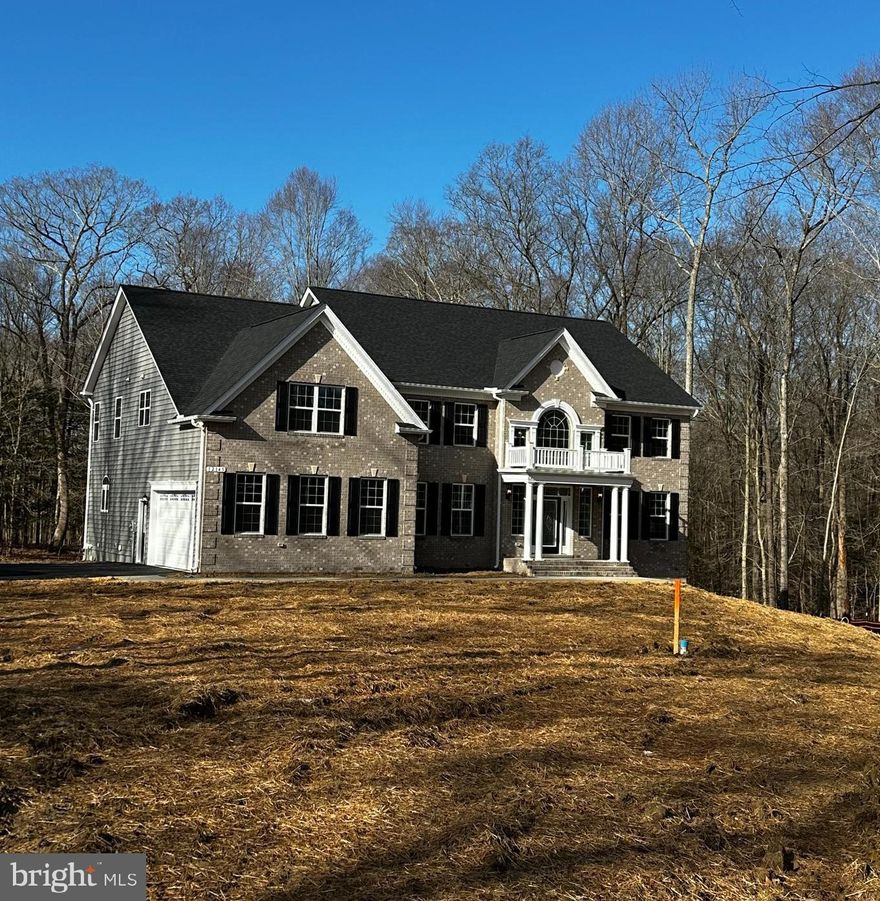 Sold!!!  QBHI's brick front Westminster on this large, private lot in Fischer's Grant. Enter the main foyer to a grand staircase with separate living and dining room to either side of the stairs.  Features include a large 2 story family room with gas fireplace, upgraded kitchen and kitchen table space area, mudroom and pantry, plus a study all on the main level.  Go upstairs using the back or front staircase to 4 large bedrooms, the owners suite has a sitting room, full bath with the deluxe shower and large walk in closet. Bedroom 2 has a private full bathroom and bedrooms 3 and 4 share the hall bath. Laundry is on this level . The basement level has a rough in for future bath and plenty of storage space and future entertaining area. Call to build your QBH home today.