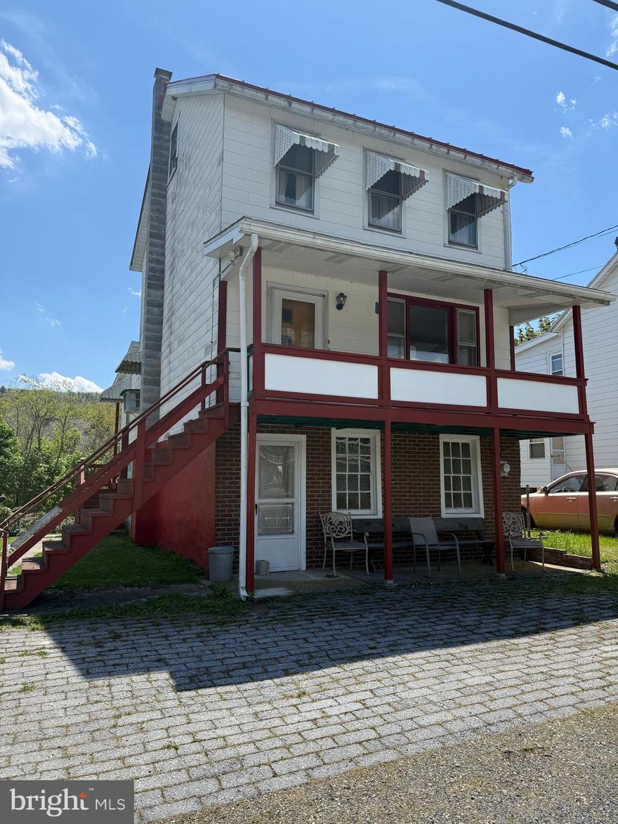 On the  market May 11!  Located in the village of Newkirk on the edge of Tamaqua this single is a great find.  The home is located less than a mile from downtown and all the schools.  It has three bedrooms, one full bath, and a basement shower.  The home has a newer heat plant, newer roof and updated electric.  The eat in kitchen has Quaker Made cabinets.  There is a formal dining space that leads into the living room that has hardwood floors.  Classic awnings cover the second floor windows.  The rear of the home has a covered porch that leads to  a fenced yard.  Enjoy the quiet life close to Towne!!  Schedule you showing!!