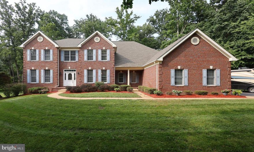 Tucked on a quiet cul-de-sac in Great Falls, Virginia, 11526 Seneca Woods Ct offers a spacious residence set on approximately 0.83 acres, featuring five bedrooms and seven bathrooms across three finished levels. The home has undergone extensive updates, including a brand-new roof installed in 2024, a completely renovated kitchen, and all seven bathrooms fully updated with new fixtures and finishes. <br> <br>
 
The main level welcomes you with well-proportioned living spaces designed for both everyday living and entertaining. Formal living and dining areas flow into a generous family room that enhances the open layout. A main-level study or bedroom provides flexibility for a variety of uses, whether as a home office, guest space, or additional bedroom. <br> <br>

At the heart of the home, the kitchen has been completely redesigned with all new cabinetry, countertops, sink, and appliances, creating a modern and functional space with abundant storage that is ideal for both cooking and gathering. <br> <br>

Upstairs, the upper level features a spacious primary suite with a sitting area, expansive walk-in closets, and a fully updated bathroom with modern fixtures, offering a comfortable private retreat. Additional bedrooms are generously sized and each includes access to a full bathroom, all of which have been completely renovated with new finishes and fixtures. <br> <br>

The lower level expands the home’s living space with a finished walkout basement designed for recreation, entertaining, or additional living needs. This level includes a wet bar, an additional bedroom, a full bathroom, and ample storage, providing versatile space that can adapt to a variety of uses. <br> <br>

Outside, the property benefits from its cul-de-sac setting and sizable yard, while an oversized three-car garage provides ample parking and additional storage. <br> <br>

Conveniently located near shopping, dining, and everyday services at Great Falls Village Centre, the home also offers easy access to expanded retail and entertainment options in Reston and Tysons. Commuting is supported by nearby access to Georgetown Pike and Leesburg Pike (Route 7), along with the Washington Metro Silver Line, while Washington Dulles International Airport provides convenient access for travel. <br> <br>

Schedule a private showing to experience the space, updates, and location offered by 11526 Seneca Woods Ct!