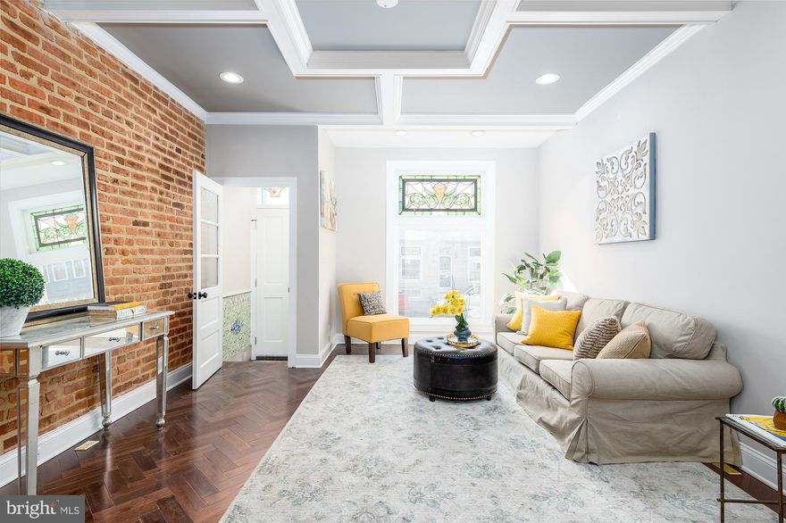 Fully renovated with premium finishes, while preserving its historic beauty, this property features exquisite attention to detail. Open and inviting floorpan, gorgeous tray ceiling, exotic high gloss finish herringbone hardwood floors, custom chef's kitchen with incredible layout, Calcutta Venice quarts counter tops, along with the trendiest architectural waterfall island. Second floor features incredibly spacious layout, with a large master suite, designer bath with Italian tile, custom niches, large walk-in shower, as well as a guest bedroom and bathroom, leading you out to a two-tier rooftop deck with incredible views of Patterson Park and Baltimore downtown skyline. Lower finished level offers a bedroom, full bathroom and a den with a walk out to the PARKING PAD in the rear of the property. Premium location on the park, close to all that Baltimore downtown offers, as well as an easy access to major highways. Same builder as 229 S Ellwood and 3417 E Pratt.