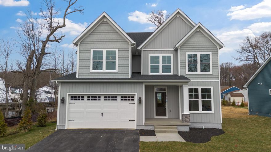 This brand-new Arlington Craftsman by Greenspring Homes is officially finished and ready for an immediate move-in at Water’s Edge on Sue Creek. The layout features a high-end gourmet kitchen that flows into a firelit family room, plus a primary suite designed as a genuine retreat with a spa-style walk-in shower. Skip the construction timeline and move straight into a home that backs to serene woods. Walk through the private community gate directly into the marina  with waterfront dining and boat slips.