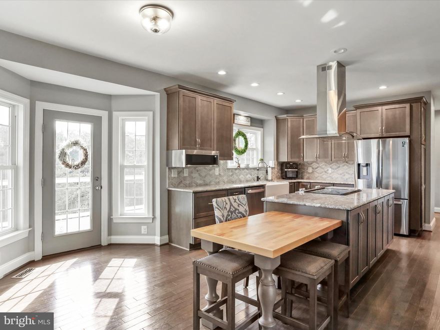 Welcome to the sought-after Jackson’s Meadow subdivision with no HOA! This spacious Quaker-built home was completely remodeled down to the studs in 2021, with everything new inside and out. Offering over 4,100 finished square feet across three levels and backing to the Sly Fox Golf Course, this property has room for everyone. On the upper level, you’ll find 4 bedrooms, including the oversized primary suite with a jetted tub, porcelain shower with glass roller door, and a large walk-in closet with built-ins. Convenient upstairs laundry includes washer and dryer. The main level is warm and inviting with hardwood floors, 9’ ceilings, crown and chair rail molding, and recessed lighting. The gourmet kitchen features granite countertops, a 7’ island with flat-top stove and hood, stainless steel appliances, and opens to a cozy family room with propane fireplace. A main level study with French glass doors makes a perfect office, while an additional bedroom and full bath provide main-level living flexibility. The finished walk-out basement adds even more possibilities. It includes a large recreation/living room, kitchenette, full bathroom, and a 6th bedroom. Plus, there’s an additional room that could serve as a potential 7th bedroom, office, playroom, or gym! Since purchase, the owners have added thoughtful upgrades, including a large deck, perfect for entertaining or relaxing while enjoying the established 1-acre lot. Other highlights include ample storage and an attached two-car garage. Just minutes to Front Royal and commuter routes, this home blends comfort, space, and modern convenience.