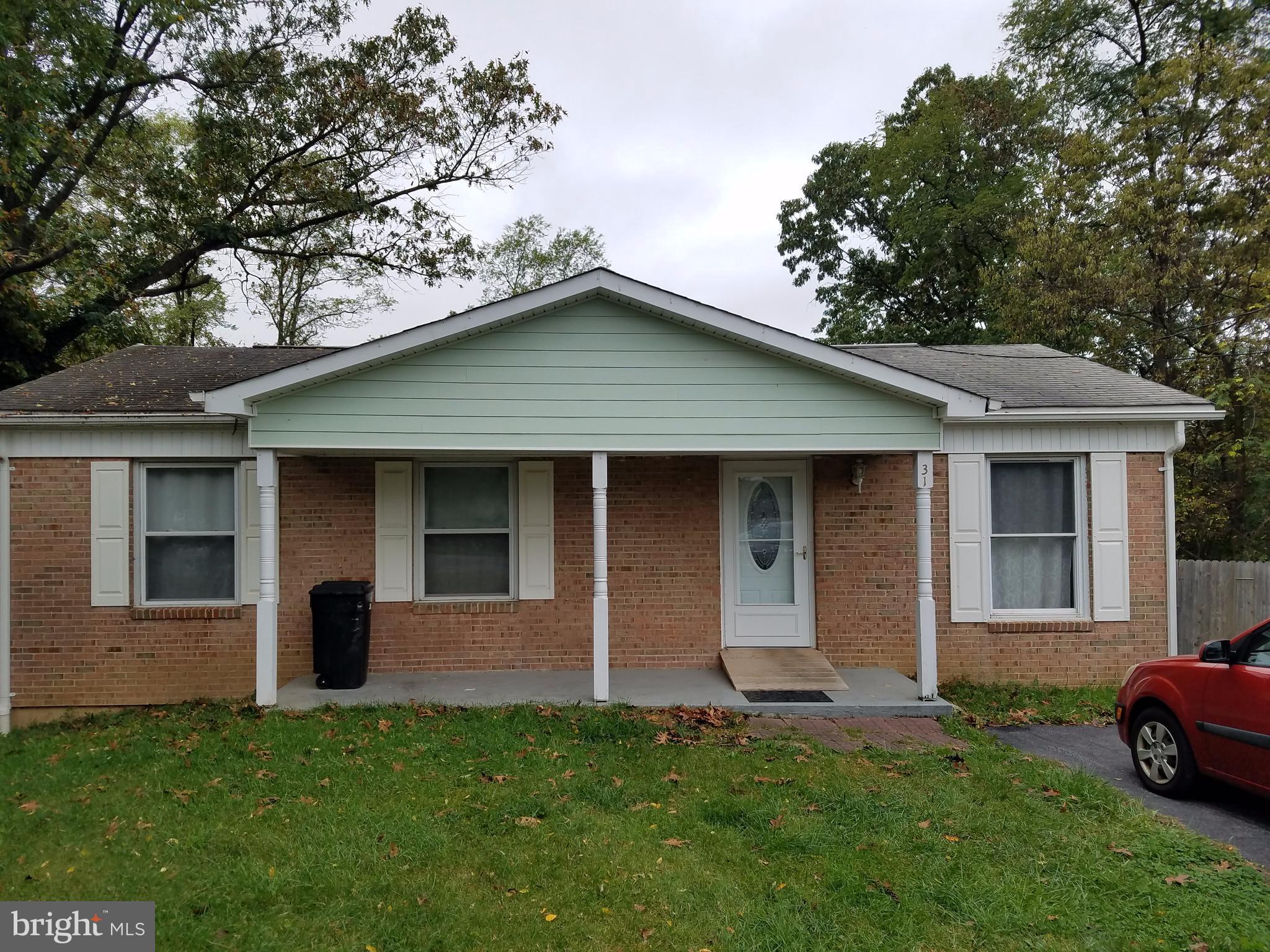 Cozy 2 Bedroom 1 Bath home. A partially finished basement, framed, wired, heated, includes additional Bedroom and full bath when completed. Easy commute to MARC train. Kitchen cabinets, carpet, countertops, HVAC system only four years old. Being Sold AS IS.