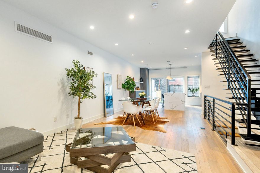 2058 E Susquehanna Ave is set on a charming, tree-lined block in one of Philadelphia’s most desirable and exciting neighborhoods. Fishtown continues to set the standard for vibrant, family-friendly living, blending walkability with an exceptional appreciation for cuisine, entertainment, education, and the arts. The impeccably maintained 4-bedroom, 3.5-bath residence sits on an oversized 17-foot-wide lot, providing remarkable interior width extended ceilings that enhance the open, airy feel on every level. The only question will be what captures your heart first — this stunning home or the vibrant, family-friendly community that surrounds it.

The main living area offers exceptional versatility  especially in the kitchen, where thoughtful design meets functionality. Waterfall-edge stone countertops, modern flat-panel cabinetry, and pro-grade stainless steel appliances set a sophisticated tone. There’s ample room for guests to gather comfortably around the island while the host cooks and stays part of the conversation. The southwest-facing sliding glass doors bathe the first floor in natural light and capture stunning sunsets that fill the home with a golden glow. Step through the rear slider to a spacious, professionally built paver stone patio and rear yard—perfect for outdoor dining, entertaining, or simply extending your living space.

The home is also equipped with a fully finished basement which includes an additional full bathroom, bedroom and full windows which can be used as a means of egress to the outside

The 2nd floor offers 2 large bedrooms; each filled with natural light from oversized windows that stretch nearly floor-to-ceiling. These rooms provide generous proportions ideal for guest suites, children’s rooms, or flexible work-from-home setups. A full  bathroom with a dual-sink vanity, marble-style surfaces, and a soaking tub serves this level with both style and function. A dedicated laundry room with stacked laundry and dedicated storage and closets for linens makes day-to-day living exceptionally convenient. 

The third floor is dedicated entirely to the primary suite, offering privacy, space, and comfort. The expansive bedroom easily accommodates a king-sized layout with room to spare for a sitting area or workspace. Dual walk-in closets provide abundant storage and organization, while the primary bathroom features a striking modern design—complete with a glass-enclosed shower, double vanity, and marble-style finishes throughout.

Just outside the suite, a built-in bar area adds convenience and extra storage, perfect for entertaining on the home’s bi-level roof deck. The rear terrace on this level is an ideal place to unwind and watch the sunset, while the upper rooftop deck offers sweeping city and neighborhood views—a true extension of the home’s living and entertaining space.

You’re just 2 minutes from the El subway and steps from the best that Philly has to offer. Walk to Award-winning restaurants & cafés, Craft cocktail bars & breweries, Art galleries, music venues & community events. Fishtown is known for its creativity, culture, and neighborly feel — and this home is right in the heart of it all.

The Property was recently subdivided from a large parcel with the same address, OPA #313028900. The deed of subdivision is being filed with the city of Philadelphia. all subdivision plans and permits have been uploaded to this listing

**3 YEARS REMAINING ON FULL 10-YEAR TAX ABATEMENT