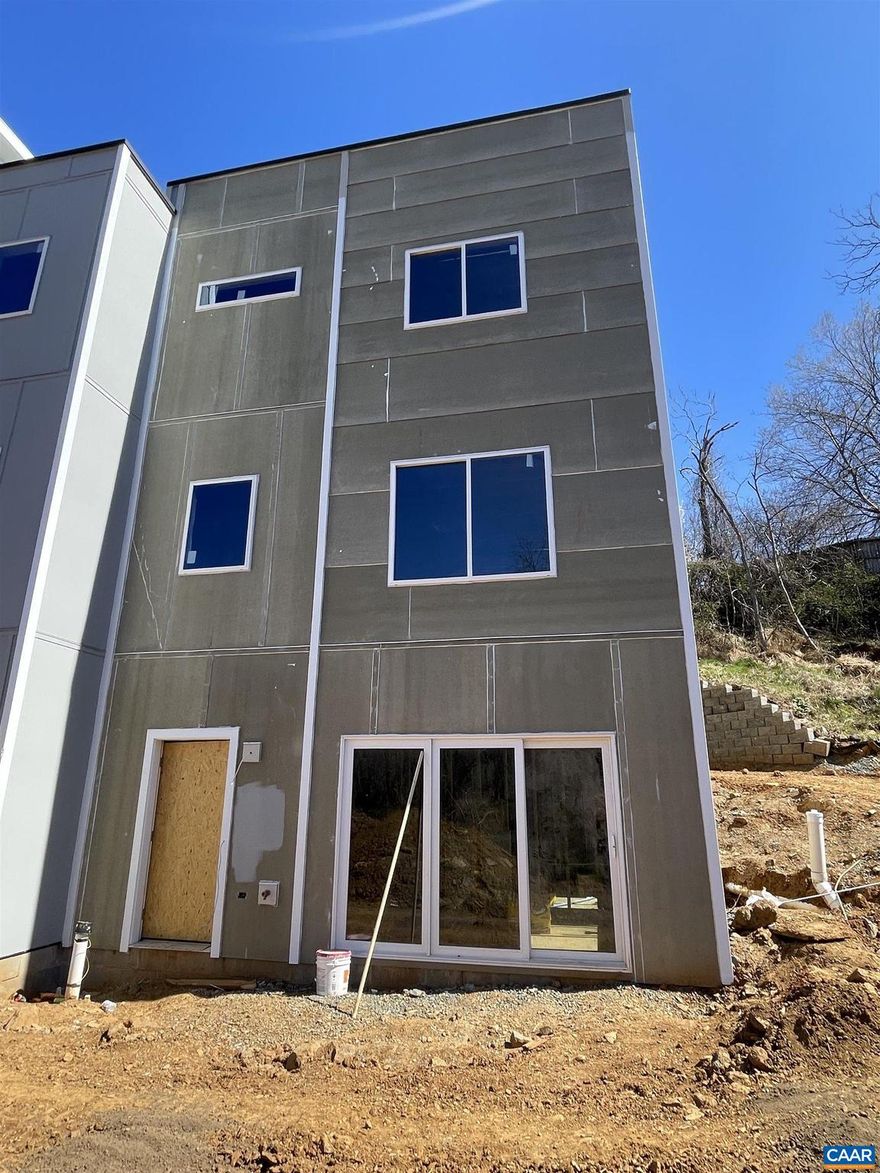 Beautifully designed, modern new construction in Belmont to be completed Summer 2023. This three bedroom home features a contemporary design with over 1980 square feet of living space. The lower level includes a rec room and guest room with full bath. The second level features a contemporary designer kitchen, dining area, and living space with lots of natural light. The third level includes the owner's suite with en-suite bathroom, secondary bedroom, full hall bath, and laundry room with door to spiral staircase leading to a rooftop terrace with Creek and Mountain Views!  Desirable cul-de-sac location offers unbelievable privacy just steps from Moore's Creek and the Rivanna Trail.  is only only block from Belmont Park and is convenient to Downtown Charlottesville, 5th Street Station, and I-64. This is a truly one-of-a-kind design and unique offering in Belmont. The photos are of renderings of construction and of similar finishes.,Quartz Counter