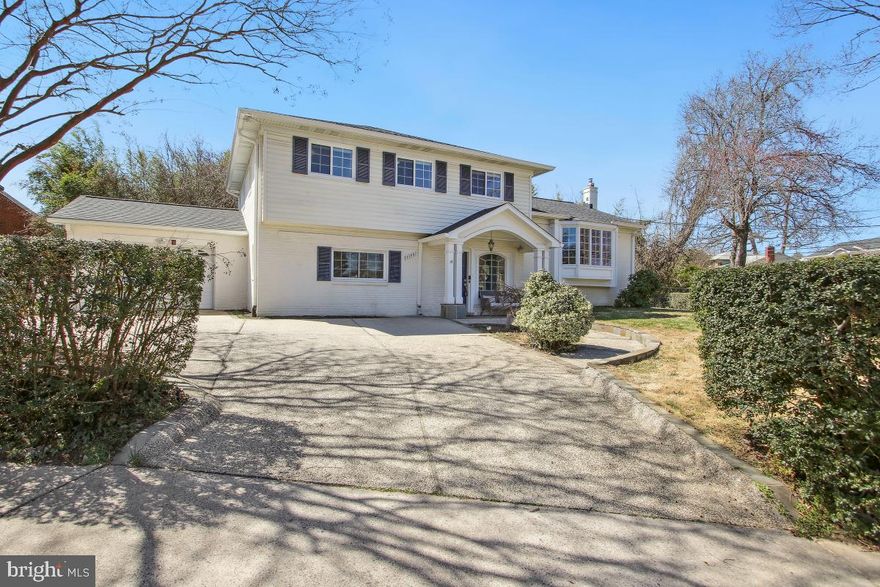 Welcome to 7708 Whittier Blvd.! This stunning brick front single-family home is located in desirable Bethesda! Enjoy over 3,000 square feet of living space on a large .28-acre corner lot. The home includes 5 bedrooms and 3.5 bathrooms with an attached garage. Enjoy a main level primary suite with a huge walk-in closet and private ensuite bath. The ensuite includes a dual sink vanity and a gorgeous walk-in glass and tile shower. The gourmet eat-in kitchen is upgraded with custom cabinetry, granite countertops, and stainless-steel appliances including a gas cooktop and wall-oven. The kitchen flows out to the back maintenance free Trex deck and down to the huge patio and fully fenced backyard ideal for entertaining. The formal dining room has ample room for a large table and features beautiful molding details. The living room is bright with a bay window and floor to ceiling bookshelf that conveys with the home. The upper bedroom level includes 4 bedrooms and 2 bathrooms. The secondary master bedroom is large with a private ensuite bath, renovated in 2020. The ensuite is renovated with a walk-in shower featuring beautiful tilework detail. The secondary bedrooms are all well-appointed and share another renovated full bath (2020).  The lower-level family room is spacious with attached utility and laundry room. The home is well maintained with new hot water heater (2024), new deck and patio (2022), new wall oven and microwave (2021), new fridge and cooktop (2019). Have peace of mind knowing that the roof, gutters, and windows were all replaced in 2020. Prime location with easy access to 495 and other major commuter routes including public transit. Walkable to local schools Walt Whitman High and Thomas Pyle Middle. Just minutes to shops, restaurants, and entertainment venues in downtown Bethesda. Schedule your showing today!