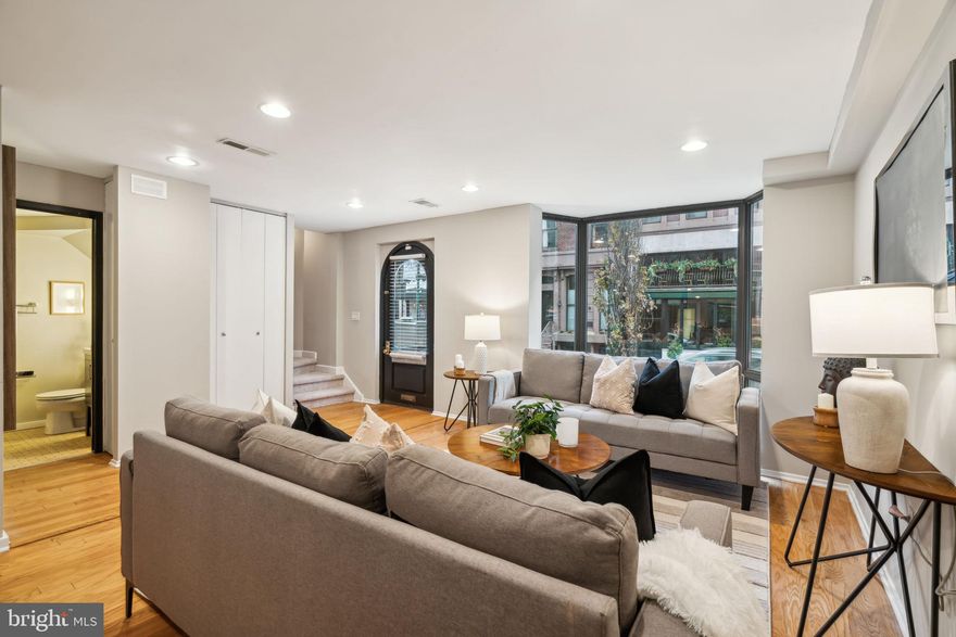 Wanamaker House townhome with three bedrooms and two and a half bathrooms. This recently renovated home features wood floors and new carpets on the stairs and hallways, as well as recessed lighting throughout. The first floor offers a great room overlooking Walnut Street; modern kitchen with flat panel cabinetry, stainless steel appliances, a glass tile backsplash and solid surface countertops; powder room with newer vanity; and direct access to the building's garage via a private storage room. The second floor houses the primary suite with a sizable closet and enlarged ensuite bathroom with double vanity and walk-in seamless glass enclosed shower. The third floor has two additional bedrooms, both with floor-to-ceiling bay windows. There is a shared hall bathroom, a laundry area with side-by-side washer and dryer, and additional hall closet space. Wanamaker House townhome residents have access to all the services and amenities of the building while also having the privacy of a single family home. The best of both worlds! The Wanamaker House is located just off Rittenhouse Square; residents enjoy a 24-hour doorman, roof top swimming pool, fitness center, resident lounge with catering kitchen, and on-site garage parking for a fee. One parking spot in the building's garage is available for purchase.