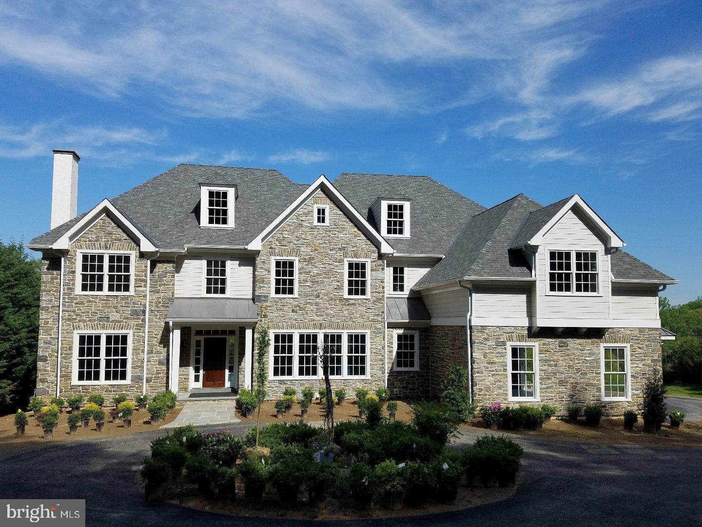 From Pennstone Homes, A Must See Transitional style NEW construction home! Immediate Delivery! Stunning custom NEW construction home in prime Gladwyne location. Fenimore development. A custom natural glistening mica stone blend adorns the front facade. Enter past the hemlock trees down the driveway to this stunning home with Circular driveway on nearly an acre of land. Over 5900 square feet on 2 levels plus a walkout lower level. Designer selected high end finishes throughout, chosen for the most discerning buyer. Home proudly boasts of 5/6 Bedrooms, 4 full + 2 half baths and a 3 car garage with wood carriage style overhead garage doors in the premier Lower Merion School District. The home flows openly, showcasing a desirable Kitchen/Morning Room/Family living area with a traditional Main Line colonial floor plan. The sophisticated Kitchen includes a tasteful design, featuring Sub Zero, Wolf and Bosch appliances, a Butler's Pantry with a wet bar and Sub Zero refrigerator, Walk-in Pantry, White Quartzite countertops, farm sink, subway tile backsplash and low voltage cabinet lighting. Large family room with coffered ceiling and cast stone mantel on wood or gas burning fireplace. The exquisite Master suite provides for both elegance and comfort. Here you will find a grand bedroom with tray ceiling overlooking the rear yard. Dual Master Vanities, a slipper soaking tub and multi-function thermostatic shower. His and Her closets with built in shelving and cabinetry and a private linen closet. The 2nd level features 4 more bedrooms, 3 bathrooms and an upstairs recreation room or use as a 6th bedroom. Gorgeous site finished oak hardwood flooring and luxurious Masland carpeting in the upstairs bedrooms. Elegant custom millwork. Main floor office with custom built-ins and walnut top desk. Extra large and functional mudroom with Family Entry bench with cabinets and grand crown moldings, casing and baseboard. The elegance of the home is complemented by quality of its construction. A four zone HVAC system is used with two 90% Heaters and 13 SEER condensing units. LED recessed lighting throughout. WALKOUT lower level with 9 ft ceilings, already plumbed to a full bathroom. Large level back yard with flagstone patio, boulder wall and room for a pool. Great vistas to acres of Fenimore open space. Minutes to highways, Center City, major employment centers and trains to NYC. Close to area parks and walking trails. Truly a MUST see home that is NEW, elegant and ready!