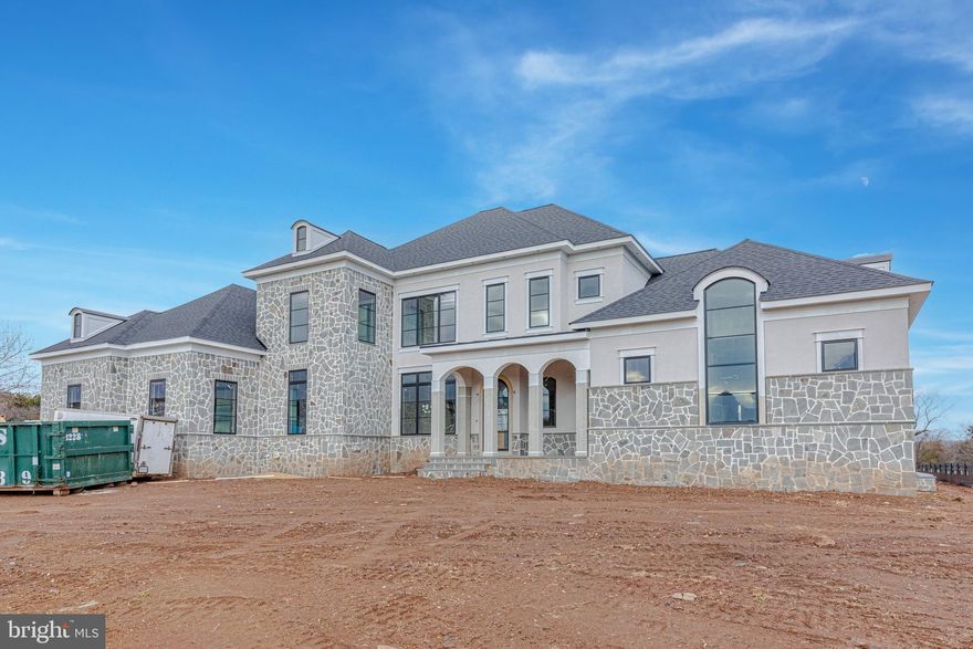 A stunning, Transitional masterpiece sited on a one acre premium lot behind the gates of Creighton Farms Country Club and overlooking phenomenal views of the community's premier Jack Nicklaus Signature Golf Course. Built by the esteemed luxury home builder, Novella Custom Homes, this magnificent new construction property blends sleek sophistication and elevated comfort. Every detail of this home has been thoughtfully curated and designed to include a handsome stone and stucco elevation; three car side load garage; wide plank hardwood floors; elegant three-piece crown moulding; a glass enclosed wine storage in the formal Dining Room for the wine enthusiasts; three gas fireplaces in the Great Room, Primary Suite, and Rec Room; Gourmet Kitchen for Chef's of every skill level with a center island perfect for entertaining and prepping, professional grade stainless steel appliances, Quartz counters, a walk in pantry, and a Butler's pantry to service the formal Dining room; a Great Room off the Kitchen seamlessly flows to the covered terrace with golf course and breathtaking sunset views; luxurious main level Primary Bedroom Retreat with lavish En Suite spa-inspired Bath including a walk-in dual-head shower, soaking tub, and two spacious walk in closets; Main level Laundry and Mud Room are conveniently located off the garage and Family entrance to the home; Upper level of the home boasts three generous sized Bedrooms each serviced by their own private Bath and an open Loft/Home Office with wet bar and Powder Room; expansive, walk-out lower level of the home includes a Rec Room and Game Room with a full wet-bar and wine storage, a home Exercise Room, an open Media Room, a Guest Suite with full Bathroom, a Powder Room for guests to use, and abundance of storage space. Creighton Farms is one of greater Washington DC's most extraordinary, exclusive private club communities. The crown jewel at Creighton Farms is the 18-hole Jack Nicklaus championship golf course. Unparalleled resort style amenities include a brand-new state of the art golf facility with heated indoor bays, two Har-Tru & two USTA hard-surface tennis courts, fitness & wellness facilities, a resort style pool and an elegant Club House offering indoor & al-fresco dining, overnight club rooms for members and guests, Board Room, Library, Golf Shop & more. Home expected to deliver at the end of February 2023. Please note that the floorplans shown in the photo gallery may deviate slightly from the final product. Some amenities noted in listing and photos are included with Creighton Farms Golf and Country Club memberships (not the HOA dues) and access depends upon the level of membership that is chosen.