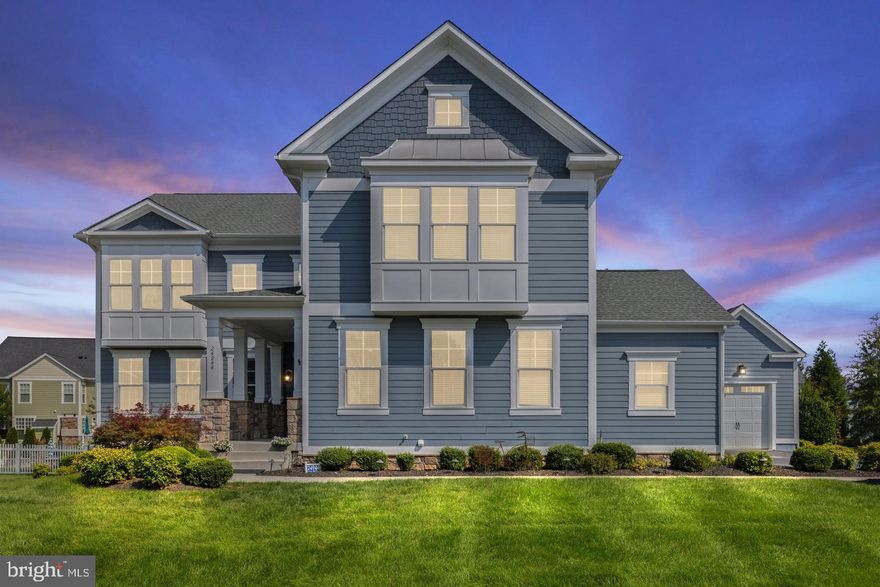 Located in the highly desirable Willowsford community, this beautifully upgraded 5-bedroom, 4.5-bath, 3 car garage home offers a perfect blend of luxury, function, and modern design. The interior is anchored by a fully renovated chef’s kitchen featuring quartz countertops, custom cabinetry, under-cabinet LED lighting, a large island with prep sink, two pantries, and a workstation sink with accessories, along with premium Dacor graphite stainless appliances including a 48” six-burner gas range with griddle, double electric ovens with convection and steam cooking, modernist hood with Wi-Fi connectivity, counter-depth French door refrigerator with water and cocktail ice, dishwasher, and under-counter microwave. The main level showcases new luxury vinyl plank flooring, while the upper level features plush new carpeting and a spacious primary suite with frameless glass shower and custom closet system, complemented by custom closets in the secondary bedrooms. The mudroom is enhanced with a shoe storage system and refrigerator hookup with water and ice, plus an additional pantry with custom shelving for added organization. The lower level is ideal for entertaining with a media room wired for surround sound and a bar-style kitchen with granite countertops, tile backsplash, dishwasher, wine chiller, and built-in A/V speakers. Outdoor living is just as impressive with a large patio, 12’ x 12’ pergola, wood-burning fire pit with circular seating bench, and privacy landscaping, along with an invisible fence system surrounding the entire yard. Additional highlights include ceiling-mounted A/V speakers throughout, built-in security system, lawn sprinkler system, crown molding, and wooden blinds. Enjoy all the amenities of Willowsford including miles of trails, community pools, fitness centers, and farm-to-table lifestyle programming, with convenient access to major commuter routes, shopping, and dining — this home truly offers comfort, technology, and elegance in one exceptional package.