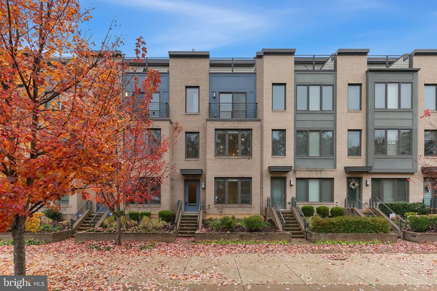 Introducing a Contemporary stunning 3 bed, 3.5 bath townhouse, with a bonus room, in the sought after EYA Montgomery Row neighborhood in Bethesda! Nestled within walking distance to Westfield Montgomery Mall and Wildwood Shopping Center and offering easy access to I-270, I-495 and Grosvenor Metro, this home seamlessly combines modern elegance with the allure of urban living !    This 5-year-old gem boasts tons of natural light throughout all the levels, fresh paint, high ceilings, gleaming hardwood floors, recessed lights, modern kitchen, all reflecting contemporary design, creating a warm and inviting ambiance. The entrance boasts an extra room, versatile enough to serve as a study or an additional bedroom, offering flexibility to suit your lifestyle.  A stunning chef’s open kitchen on the main level features stainless steel appliances, quartz countertops, soft close drawers and cabinets, deep pantry and access to the deck. The living room features an extra bump out, providing additional space for relaxation and comfort. Recessed lights throughout the main level add a touch of modernity, creating an atmosphere of understated luxury. A half bath completes the main level! The 3rd level features the primary bedroom with an extra bump out for the additional space and comfort, 2 walk in closets and an updated bathroom which has dual sink vanity with quartz counters, updated tiling and a frameless glass shower with seat. A second bedroom with an ensuite full bathroom with a shower/ tub combo and a full size stackable laundry room and linen closet complete this level. The 4th floor offers the third bedroom with an ensuite bathroom, large open loft space for additional entertaining/ playroom and  access to the spectacular private roof top deck. Whether you're sipping your morning coffee or hosting a sunset soiree, this private oasis is the perfect escape! A community park with playground, promenade and walking paths gives the neighborhood a pedestrian-friendly feel. Nearby excellent schools, numerous medical facilities, Cabin John Regional Park and all the retail, restaurants and entertainment in downtown Bethesda. This move-in-ready townhouse is not just a home; it's a statement of contemporary living in an amazing location. Don't miss the opportunity to make this meticulously maintained property your own.