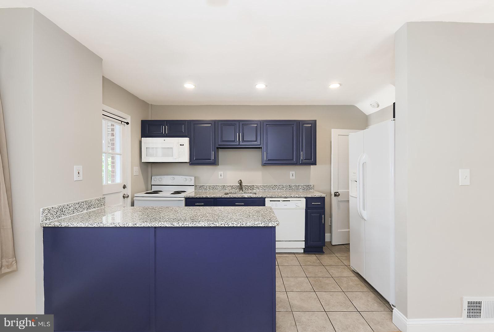Welcome to 6922 Broening Rd — a freshly remodeled gem in the heart of Dundalk Village that brings style, charm, and comfort together in all the right ways.
From the moment you arrive, the elevated front porch sets the tone — not just for curb appeal, but for neighborhood views, quiet mornings, and a front-row seat to the rhythm of the block. Step inside and you’re welcomed by a cozy living room that flows seamlessly into the dining area and kitchen, divided by a custom knee wall with bar seating — perfect for morning coffee or quick bites on the go.
The kitchen features stainless steel appliances, ceramic tile flooring, and just enough character to make it stand out without trying too hard. Hardwood floors run throughout the main level, adding warmth and a polished touch to the living spaces.
Upstairs, you’ll find two comfortable bedrooms and a shared full bathroom. But the real bonus is downstairs — a fully finished basement offering a flexible space that could easily be used as a third bedroom, rec room, home office, or second living area. It’s ready for whatever life throws your way.
Out back, the newly created parking pad offers private parking with space for multiple vehicles — a rare convenience in this peaceful neighborhood setting. The rear yard has enough room to relax, host, or just enjoy a little quiet time outdoors.
Whether you’re starting fresh, sizing down, or simply looking for a place that feels like home from day one, this one’s worth a visit.