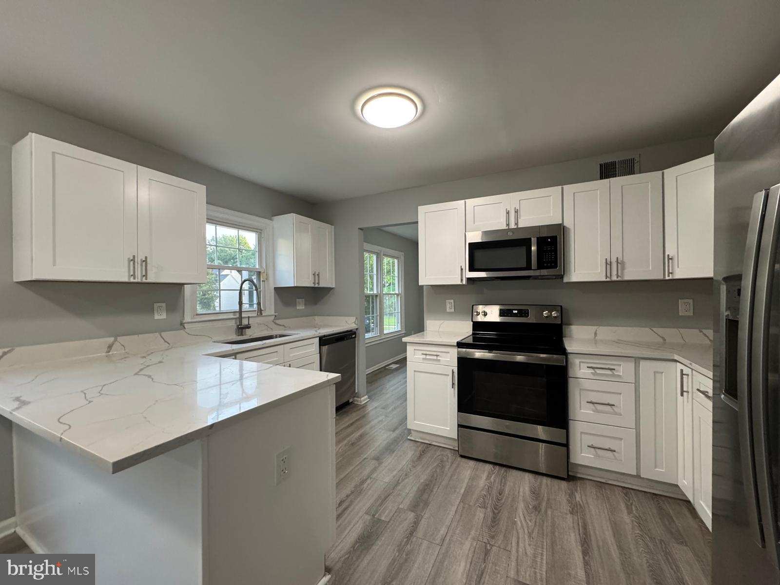 This is a beautiful 5-bedroom 3 1/2 bathroom home in Greenbelt MD. Close to shopping centers, highways, beltways, NASA, Great schools, Washington DC, Baltimore harbor, BWI, etc. Updated in 2023 with new shaker white cabinets, quartz counters, ss appliances, carpet. Fresh paint! Beautiful corner lot! This house has been refreshed with love and will fit any family. Must see pictures! Will not last long!
