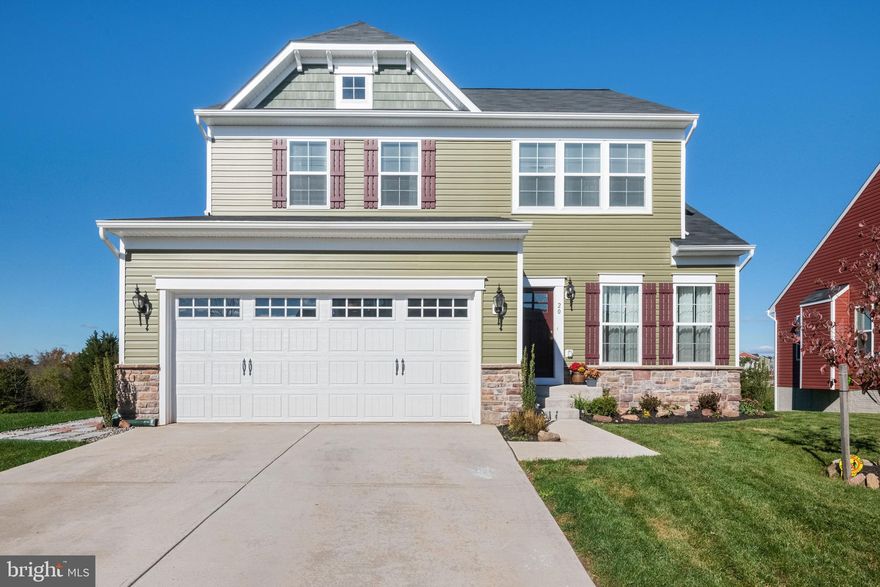 This house is in the sought after community of Meade's Crossing. This home is the Augusta model home built by Bob Ward is only one year old!  Just over 2,000 sq. ft of living space on the main and upper levels.  Complete with 4 bedrooms, 2.5 bathrooms and 2 car garage.
This place has everything you can hope for.  From the moment you walk in you'll be impressed with the finishes.  A stunning kitchen with a large island, granite counters, stainless steel appliances and a great open flow with the adjacent living room.  Off the kitchen is a slider door leading you to the new composite deck that was just installed.  The view from the deck is the best in the neighborhood and does not have any homes located behind it!
The living room has an electric fireplace and plenty of room for entertaining.  You will also find a separate dining room, half bathroom and an office on the main floor.  On the upper floor you have 4 bedrooms, 2 full bathrooms and laundry room.  The master suite offers a large bedroom and large walk in closet.  The oversized master bathroom included a soaking tub, double vanity and a seperate shower.
The lower level has a walk out with a slider door to the back yard.  Use your imagination and make this space exactly what you have dreamt.
The Homeowners Association offers a future pool, clubhouse, playground, tennis court, and walking trails! Don't miss your opportunity to make the beauty yours!!