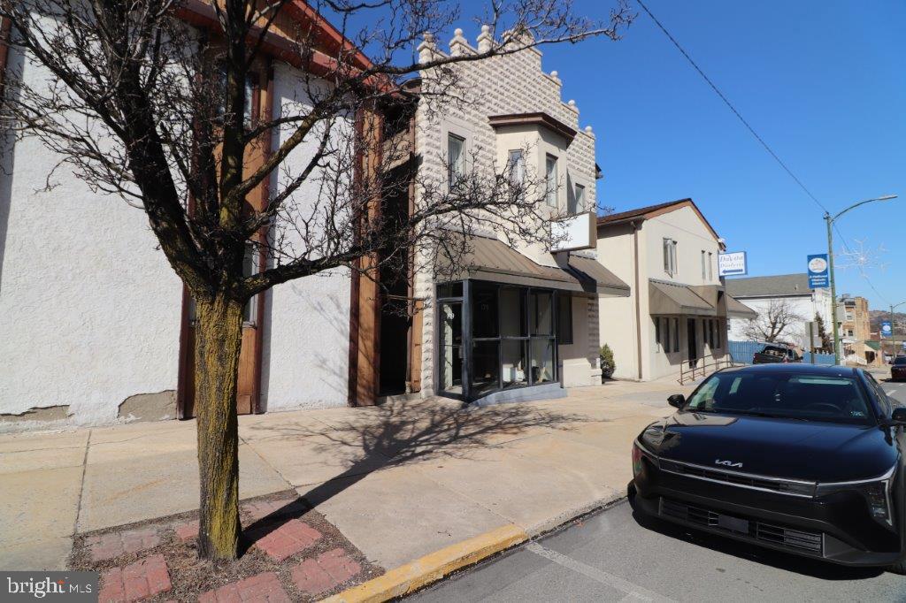 VISIBILITY AND HIGH TRAFFIC LOCATION! 1st floor 2,000 sq. ft (approx.) of prime office space on Palmerton's Delaware Avenue! Previously used as a physician's office, in GREAT condition, just needs a fresh coat of paint and maybe a few other changes to make it your own. Glass enclosed foyer makes for the perfect entrance for all seasons! Space includes a sizeable waiting room, enclosed receptionist or front office area, (5) exam or patient rooms, all installed with sinks and cabinets, (3) sizeable half bathrooms, a spacious kitchen with room for breaks, and a large room in the rear with it's own entrance that can be used as storage or converted to your needs. (See attached floor plan in documents). Great opportunity for medical office, healthcare, cosmetology, nail salon, insurance, etc. Water & sewer included in monthly rent. Garbage fees, electric, internet and other utilities are responsibility and paid by tenant. Landlord requires 1st, last and 1 mo. security deposit, for a total of $7,200 due at time of lease signing Ready for immediate occupancy! Please call listing agent with any questions.