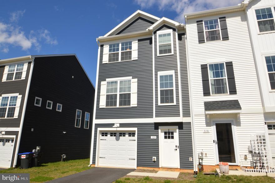 Relax and enjoy life in this beautiful end-unit townhome conveniently located in Hudson Ridge.  Many features & upgrades make this home shine!  Luxury vinyl plank flooring is installed throughout much of the home.  Granite counter tops and shaker-style cabinets bring warmth and character to the kitchen.  A centrally-located kitchen island offers extensive counter space and naturally draws you into the open concept kitchen/dining/living area.  Additionally, the kitchen boasts a water filtration system accessed at the kitchen sink.  Natural light abounds throughout the home and is an impressive feature in the spacious entry-level walk-out bonus room!  Options for this versatile space are virtually endless - home office, rec room, family room, potential 4th bedroom, etc.  Also on the entry-level floor you'll find a one-car garage and half bath.  The top-level floor offers a primary suite, including a vaulted ceiling, full bath and walk-in-closet.  Two additional bedrooms, a full bath, and laundry complete this floor and make living easy.  Hudson Ridge offers low-cost HOA fees, which maintain common areas, and provide snow removal and lawn care.  For peace of mind, the sellers installed a Vivint home security system, which can easily transfer to the new owner.  This well-cared-for townhome is an ideal location for a commute to Harrisburg, Lancaster, York - even the major Maryland metro areas like Baltimore and DC.  Move right in - with all these amazing features, not to mention window treatments plus all appliances! - for less than new.