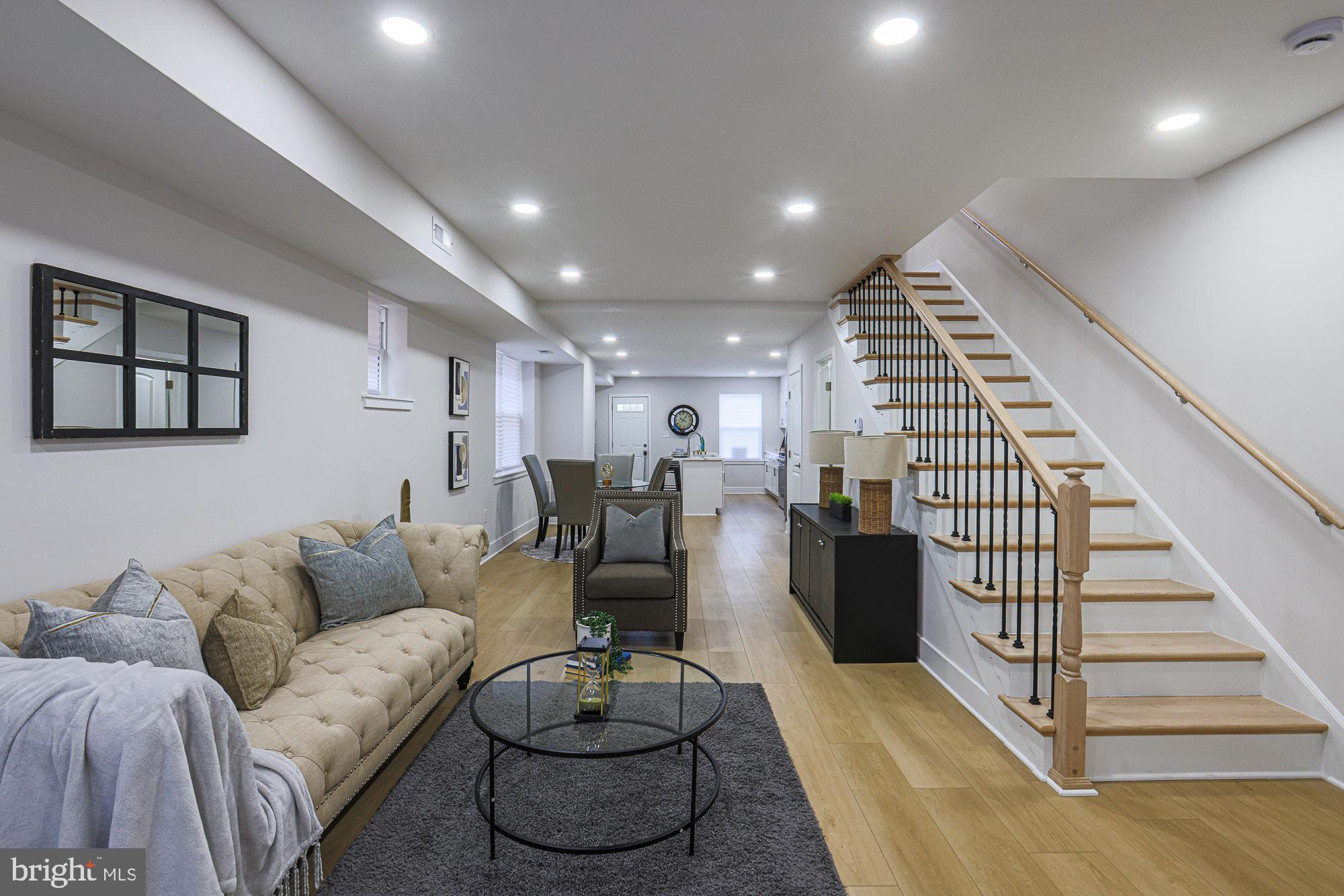Across from the lush green space of Hanlon Park, this fully renovated Tudor-style home offers the perfect mix of historic charm and modern updates. With over 2000 square feet of finished living space, this four-bedroom, two-and-a-half-bathroom home is designed to impress from the moment you arrive.yu7`gv uvzz
The striking Tudor exterior with its stone façade, arched doorway, and original architectural details sets the tone. Inside, sunlight floods the open floor plan where hardwood floors, recessed lighting, and large windows create an inviting and airy atmosphere. The spacious living room flows effortlessly into the dining area and a fully renovated kitchen featuring quartz countertops, stainless steel appliances, white shaker cabinets, and a large island with bar seating — perfect for entertaining. A powder room is conveniently located on the main level for guests. Tons of grants and down payment assistance available based on buyer eligibility.
Upstairs, the private primary suite feels like a retreat, complete with its own full bathroom showcasing sleek tilework and a walk-in shower. Two additional bedrooms and a second full bathroom round out the upper level.
The finished lower level offers incredible flexibility. This space works beautifully as a family room, home office, gym, or even additional bedroom if needed, with a separate laundry and utility area that still provides plenty of storage.
Outside, the backyard is ideal for relaxing, ( the detached garage conveys "as is") You’re steps from Hanlon Park, with its walking trails, open fields, and lake, giving you a serene escape right outside your door.